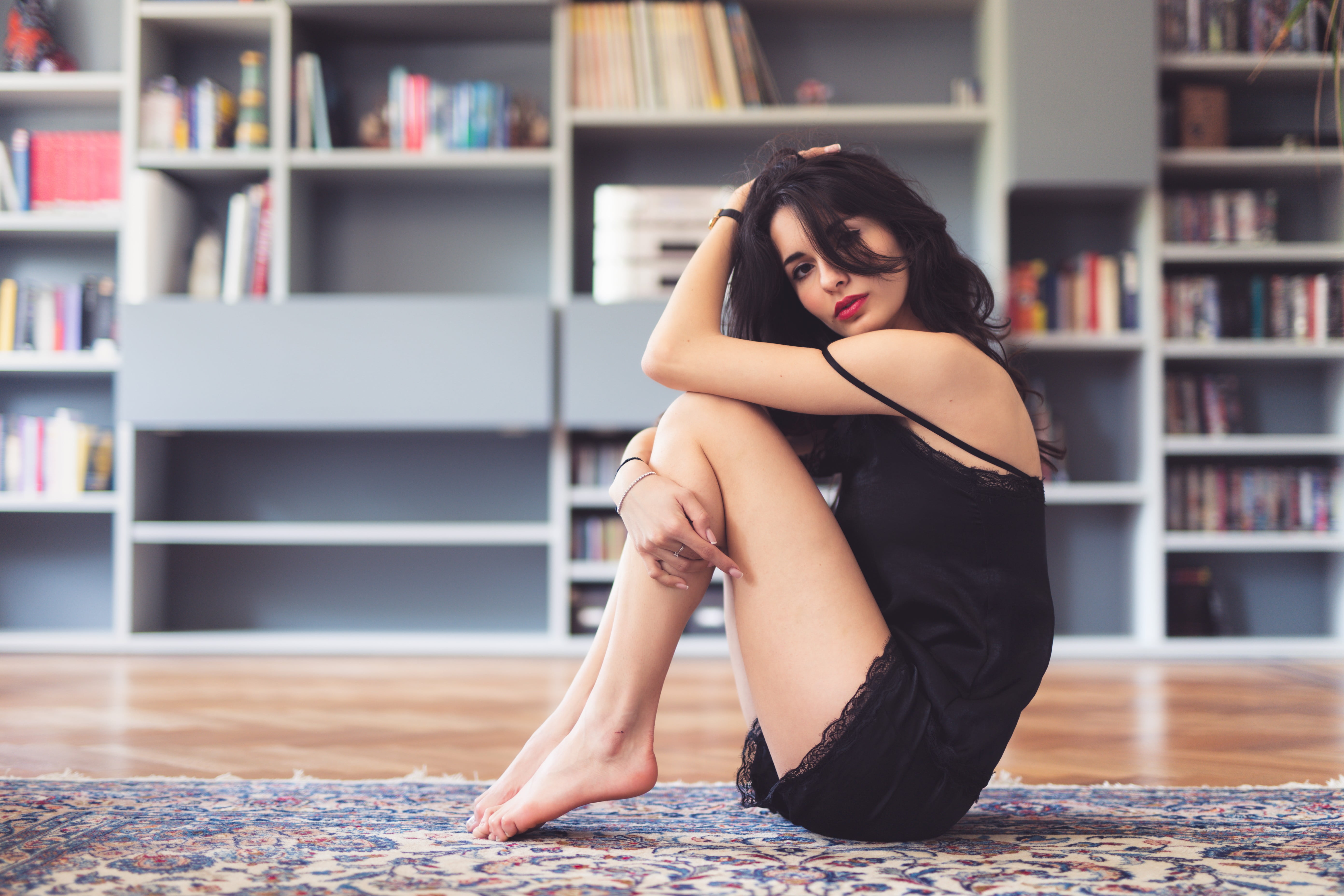 model, women, chemise, brown eyes, hands in hair, red lipstick, 5K, sitting, portrait, looking at viewer, Persian carpet, dark hair, depth of field, HD Wallpaper