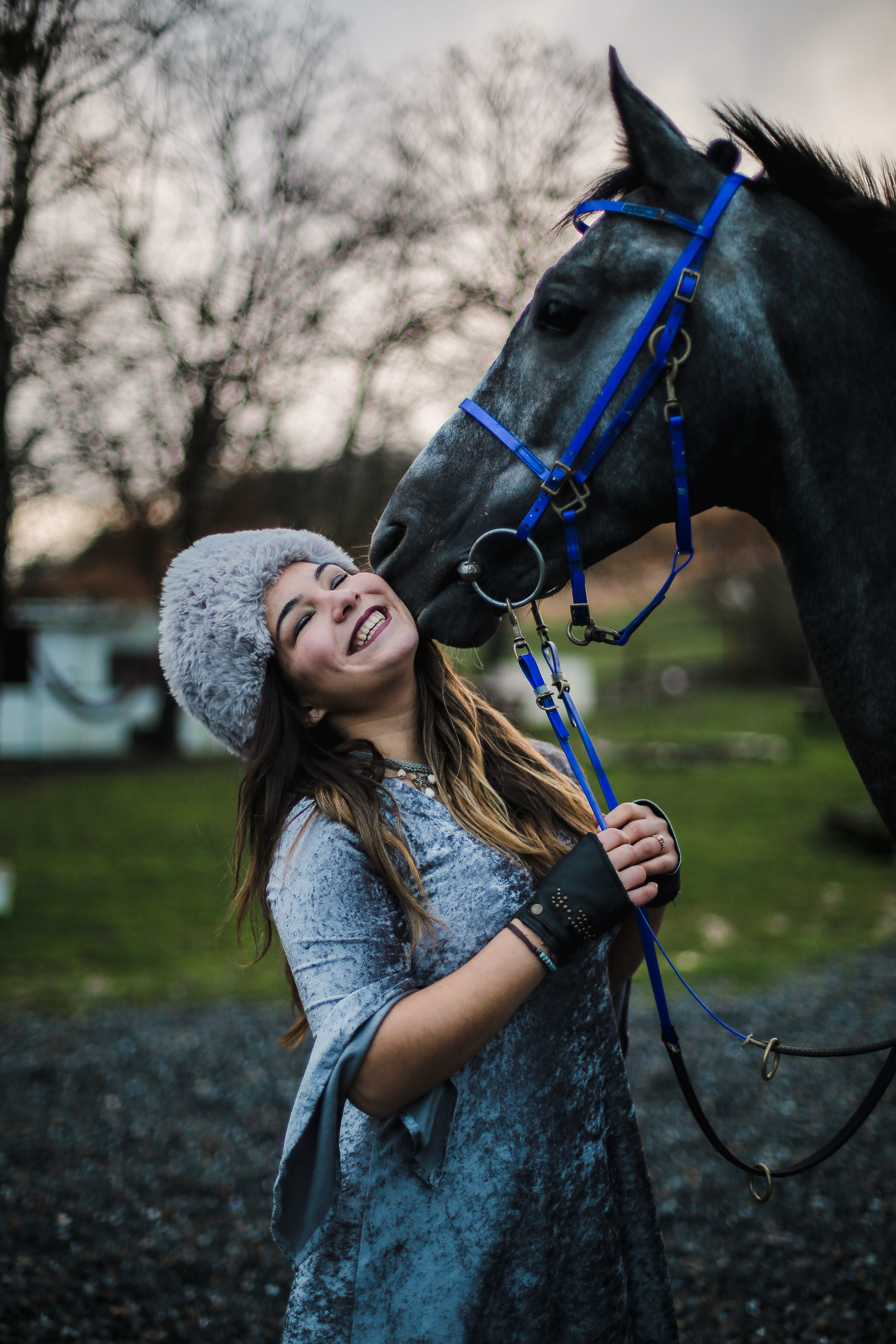 female, smiling, woman, tree, l, domestic animals, childhood, young adult, domestic, hairstyle, vertebrate, pony, g, young women, hair, pets, focus on foreground, Phone HD Wallpaper