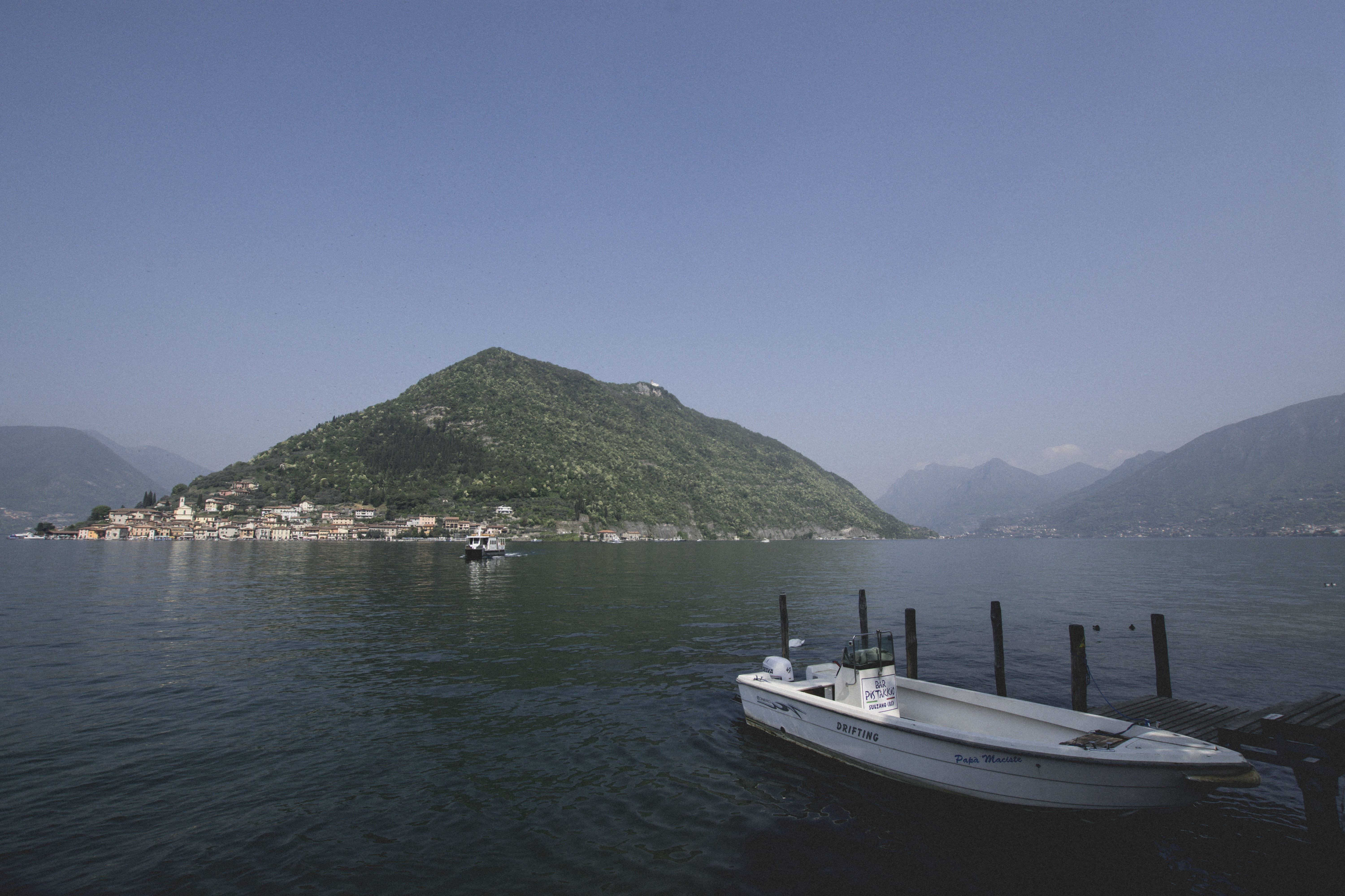 italy, sailboat, beauty in nature, lake, scenics - nature, waterfront, iseo, mountain, wooden boat, sky, moored, transportation, water, jetty, boat, island, HD Wallpaper