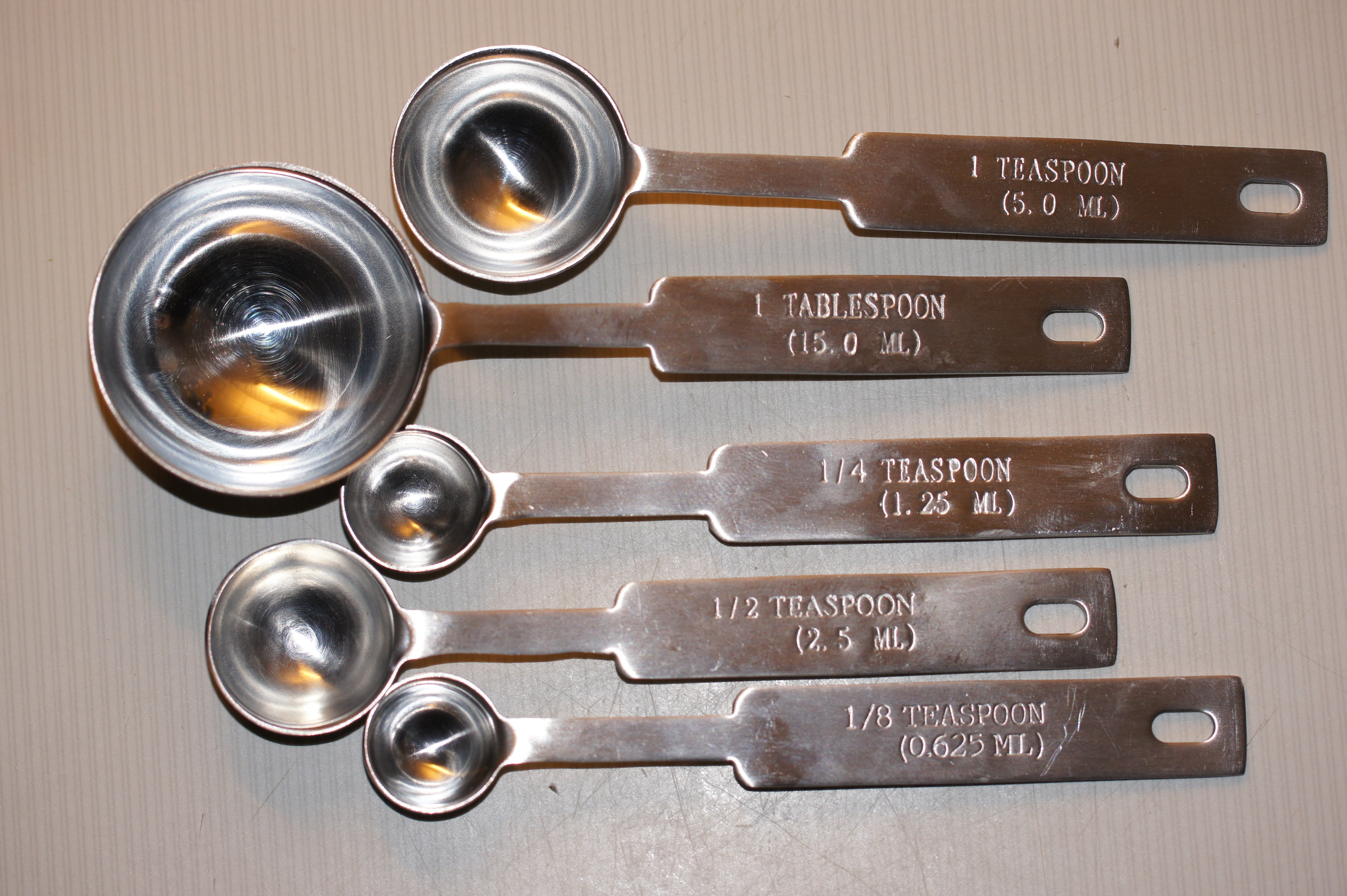 measuring spoons, silver colored, no people, baking, large group of objects, orthographic symbol, indoors, sign, table, wood - material, cooking, directly above, HD Wallpaper