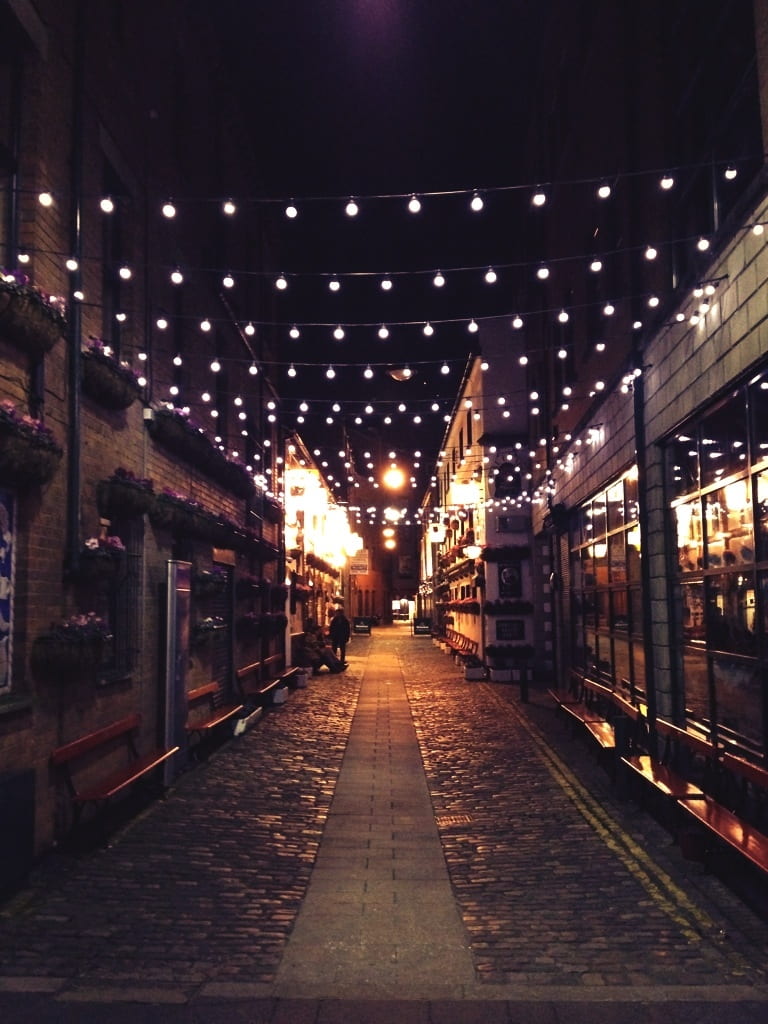 photo, bulbs, alley, building exterior, architecture, cobblestone, mood, no people, built structure, street, festive, night, footpath, city, diminishing perspective, Phone HD Wallpaper