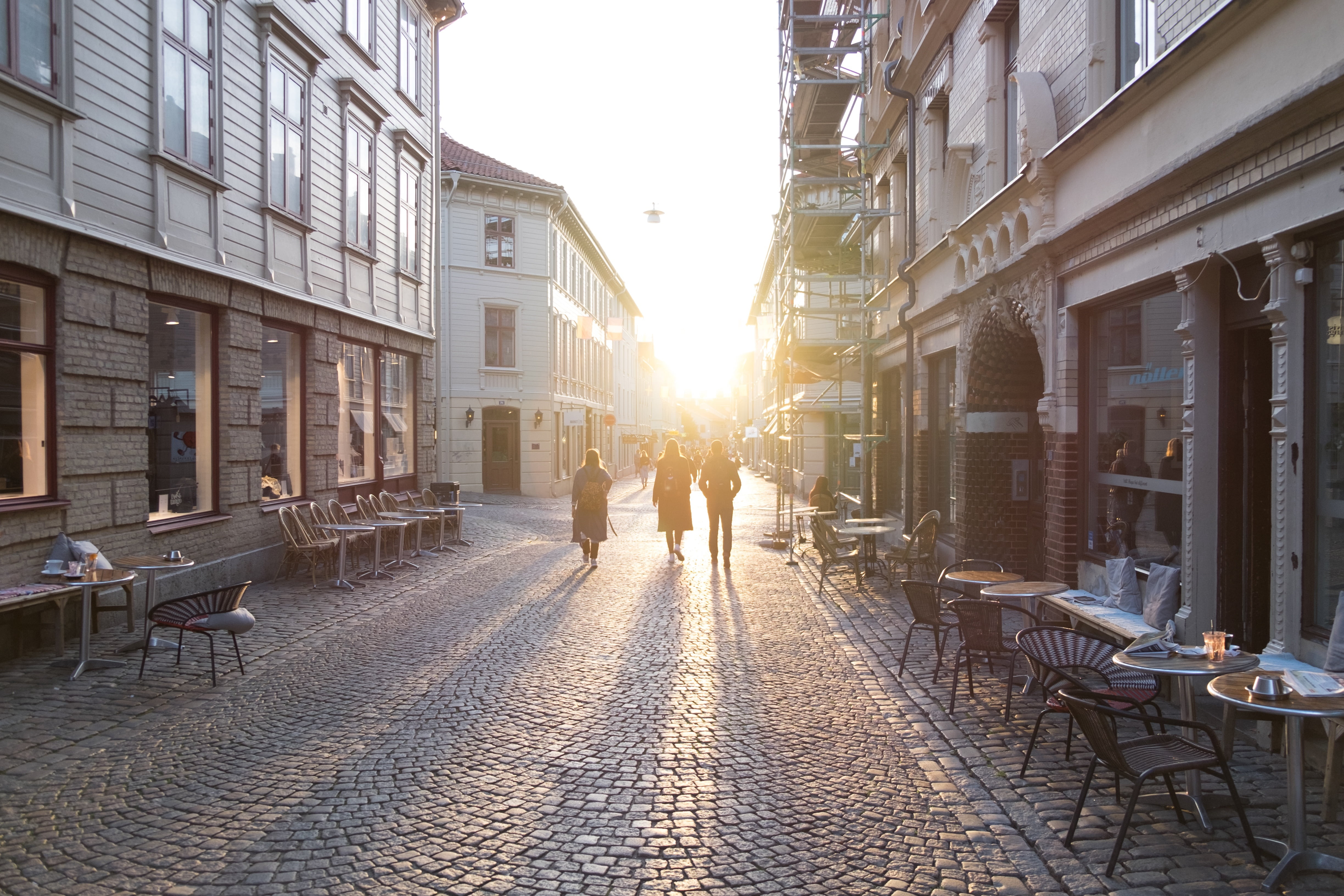 sun, pedestrians, city street, built structure, building, restaurant, incidental people, evening, two people, town, facades, sunlight, people, 4K, chairs, HD Wallpaper