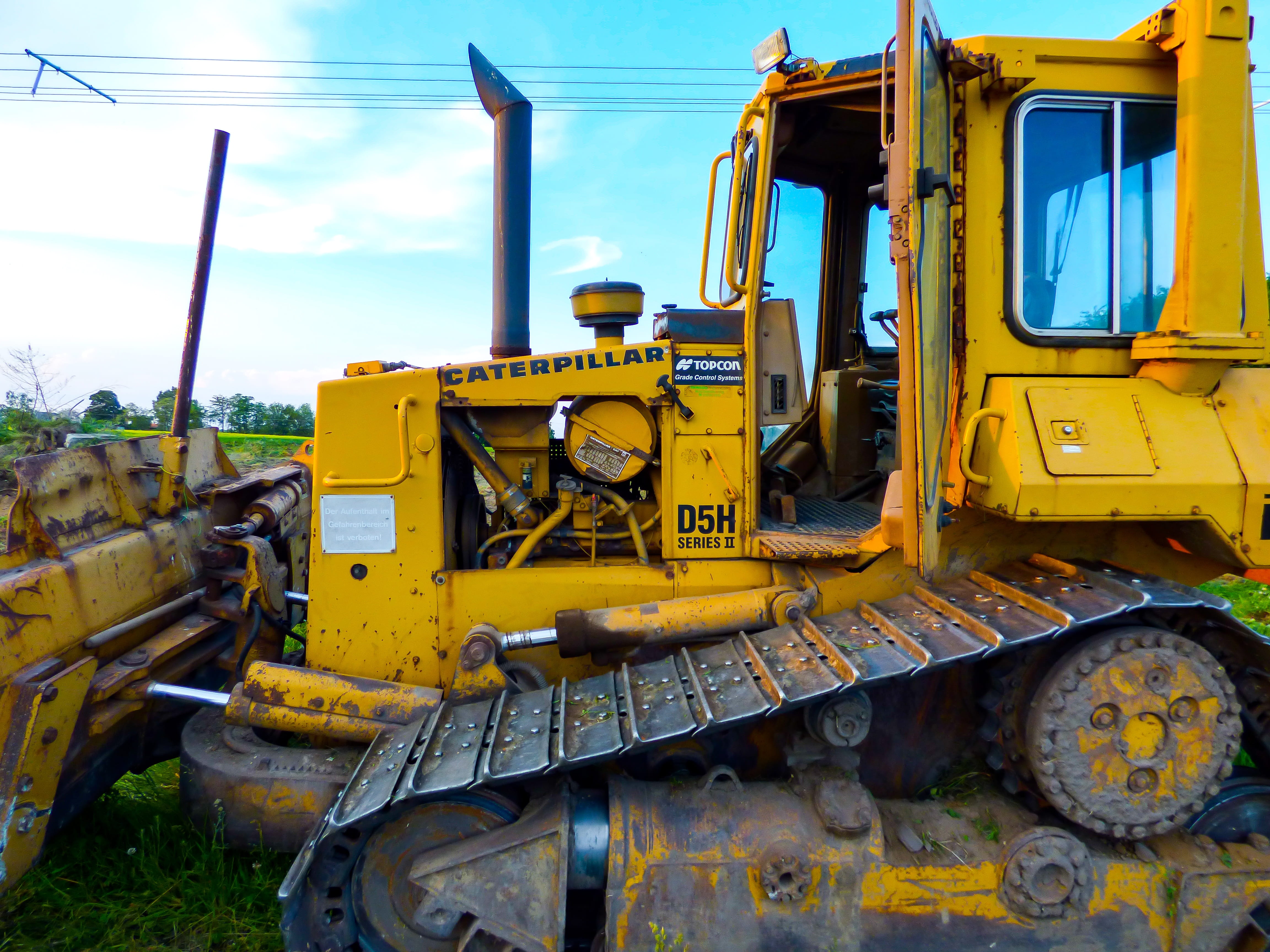 Otr, machinery, engine, day, metal, earth mover, 4K, sky, junkyard, land vehicle, Vehicle, mode of transportation, construction machinery, no people, Caterpillar, HD Wallpaper