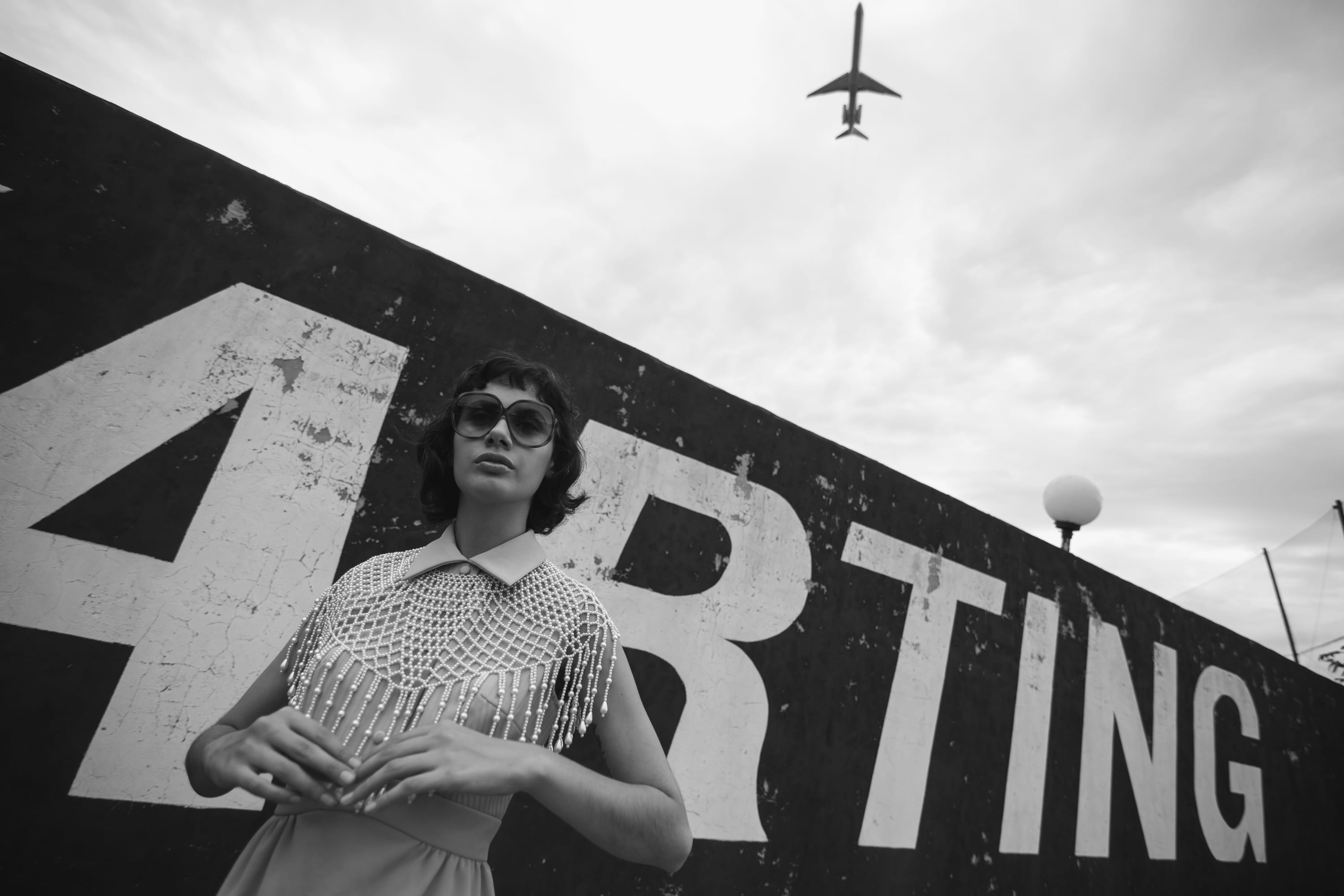 real people, plane, aviation, standing, grayscale, wear, sky, airplane, signage, casual clothing, wall, woman, air force, mode of transportation, day, leisure activity, HD Wallpaper
