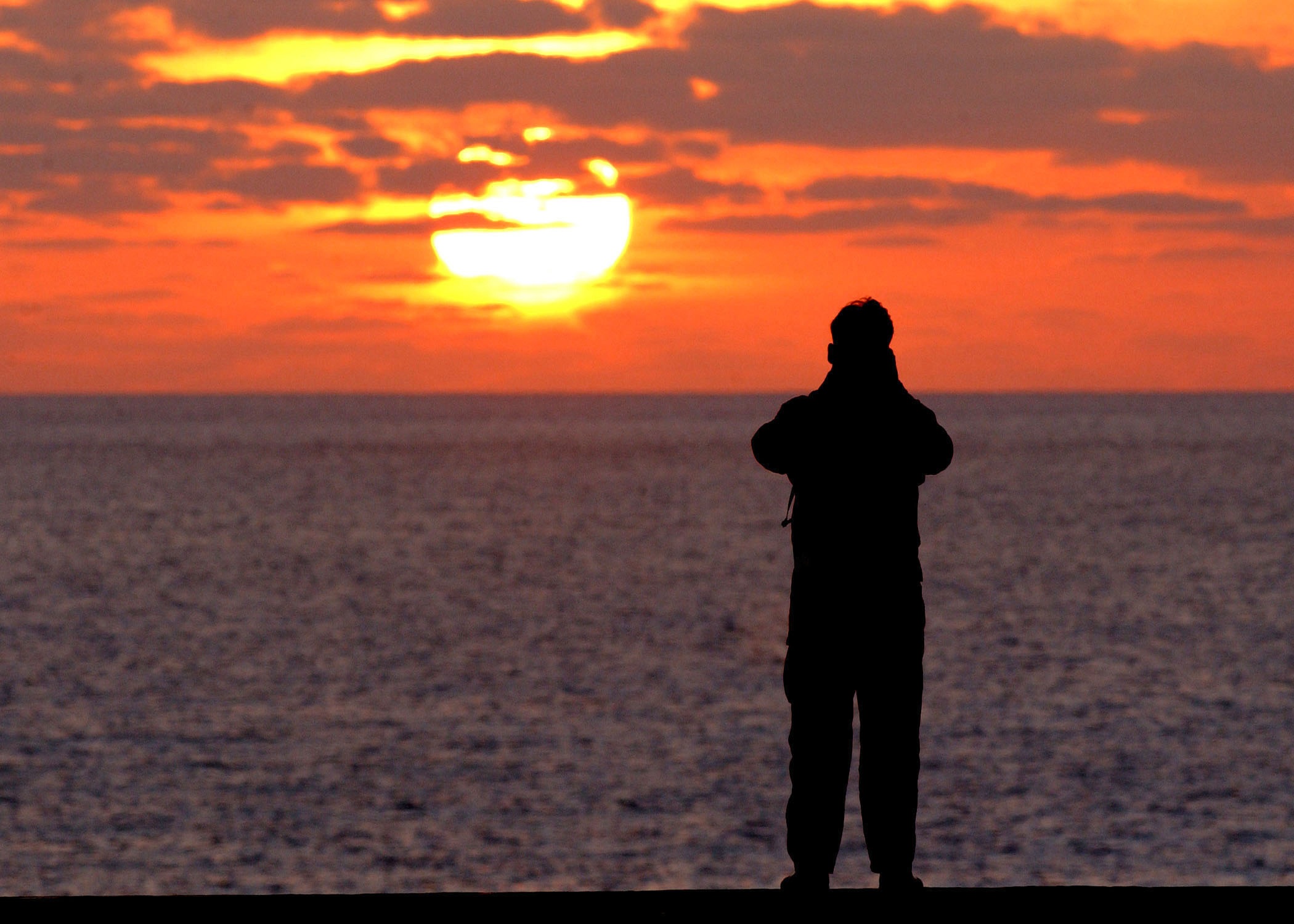 sailor, leisure activity, orange color, orange, sky, ocean, aircraft carrier, flight deck, sunset, men, sea, beach, crew, nature, land, solitary figure, HD Wallpaper