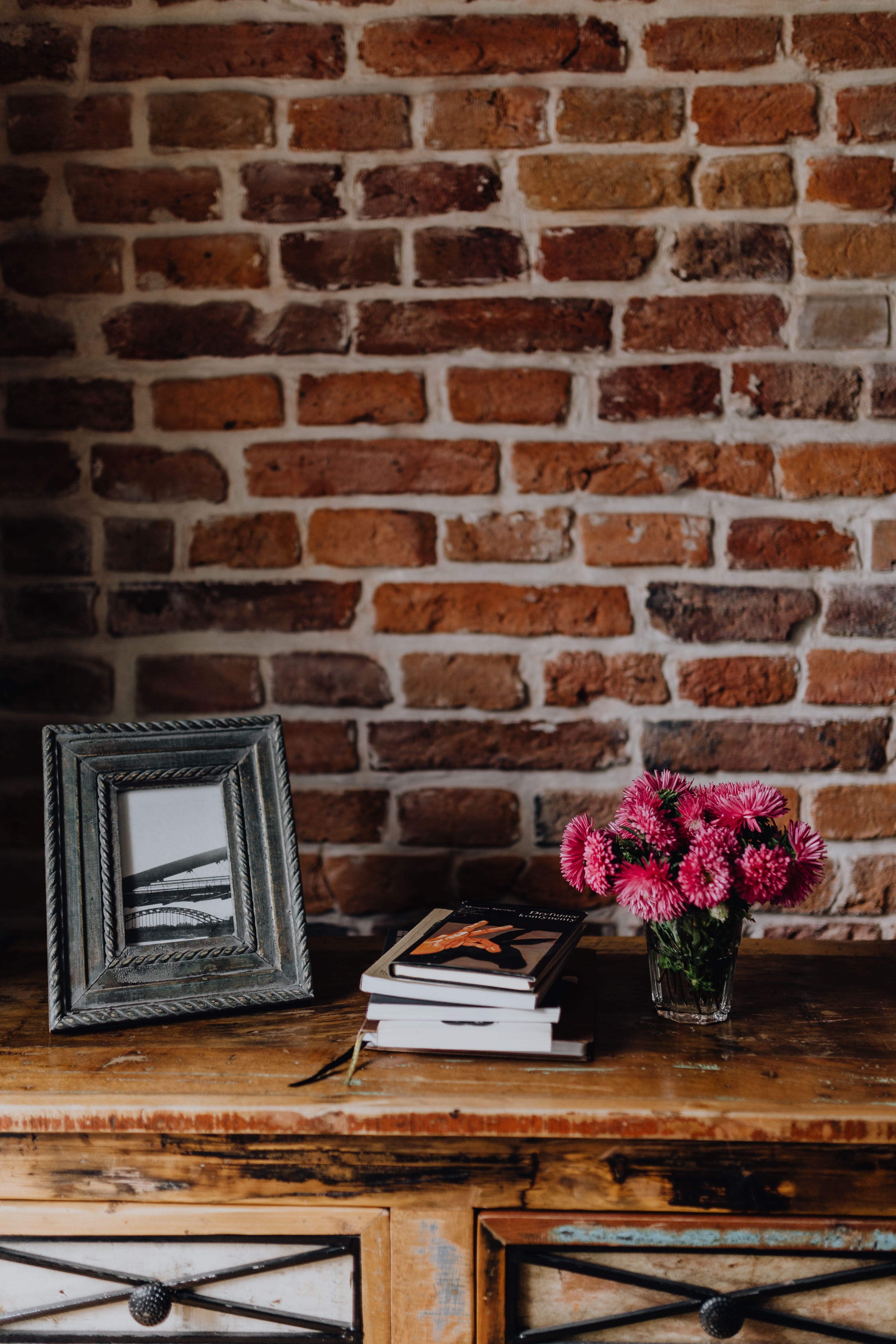 wooden, architecture, frame, brick wall, wall - building feature, wooden commode, electric lamp, flowers, wood - material, absence, books, nature, photo, Phone HD Wallpaper