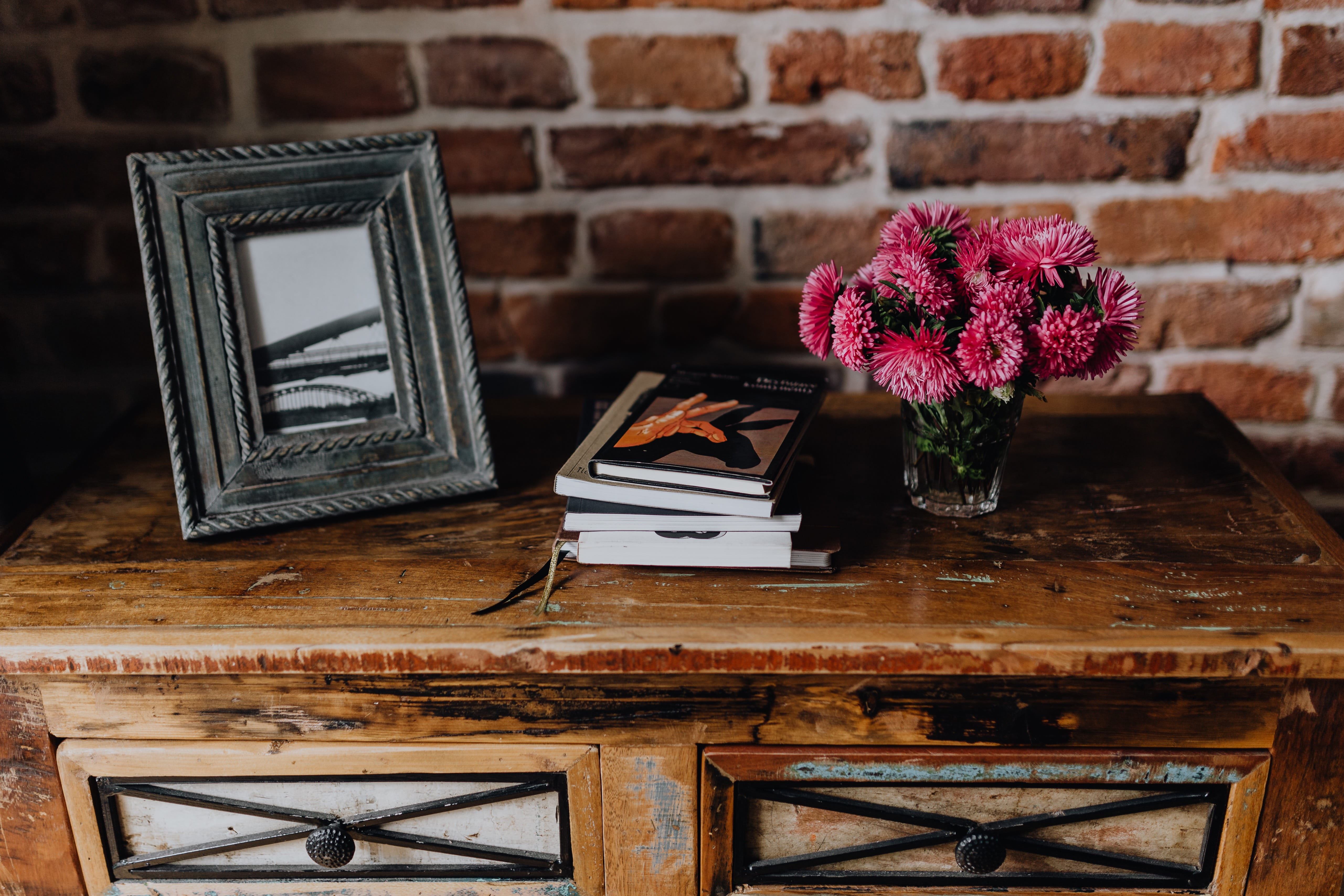 wall, books, flowering plant, table, flowers, pink flowers, no people, nature, wooden, furniture, wooden furniture, plant, still life, photo, chair, 5K, HD Wallpaper