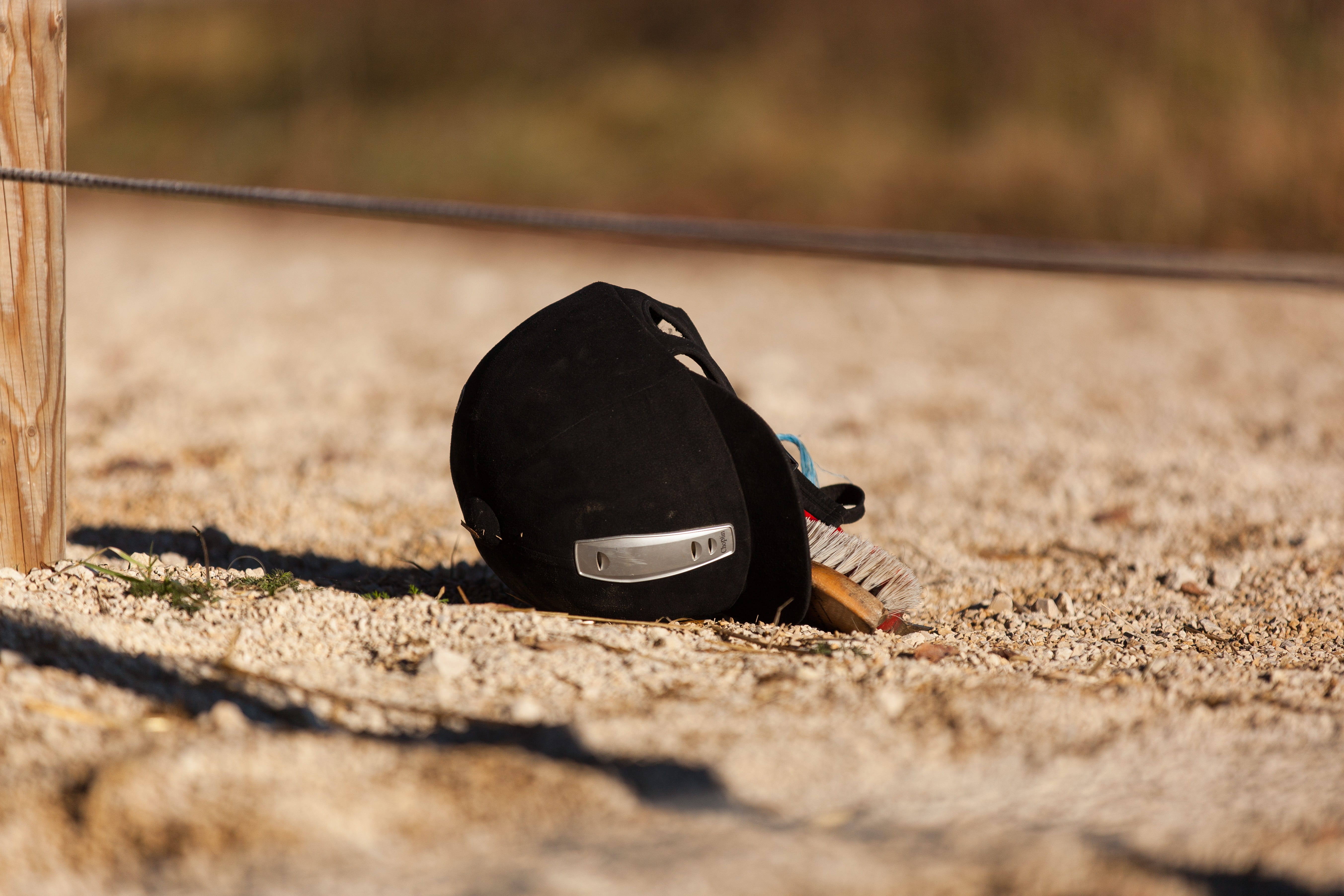 show jumping, stall, gravel, selective focus, attitude, 5K, animals, outdoors, box, open stable, riding helmet, personal accessory, black, land, focus on foreground, HD Wallpaper