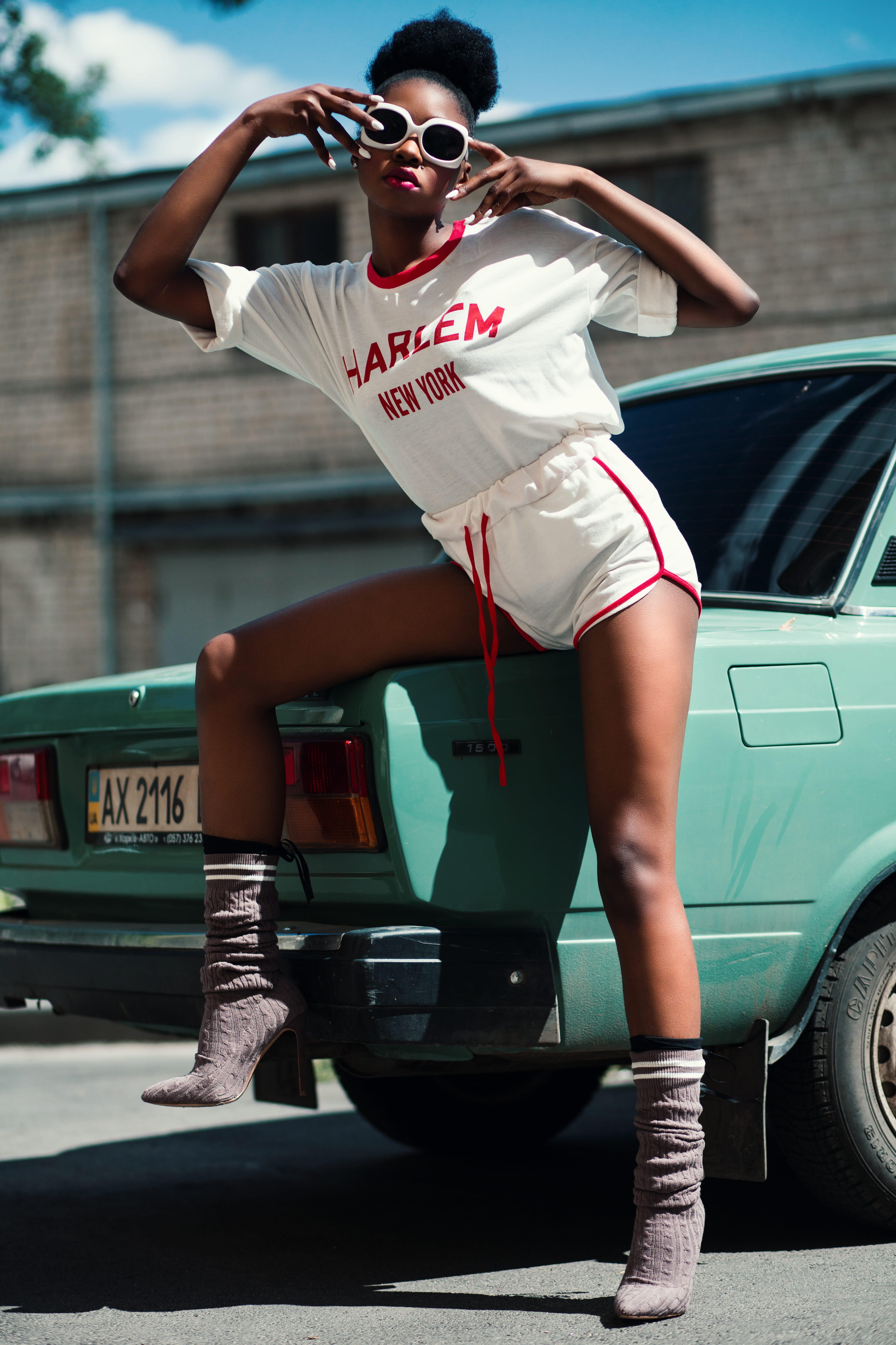 girl, vehicle, one person, vintage, day, building, front view, car, land vehicle, casual clothing, sitting, pose, glasses, mode of transportation, motor vehicle, Phone HD Wallpaper