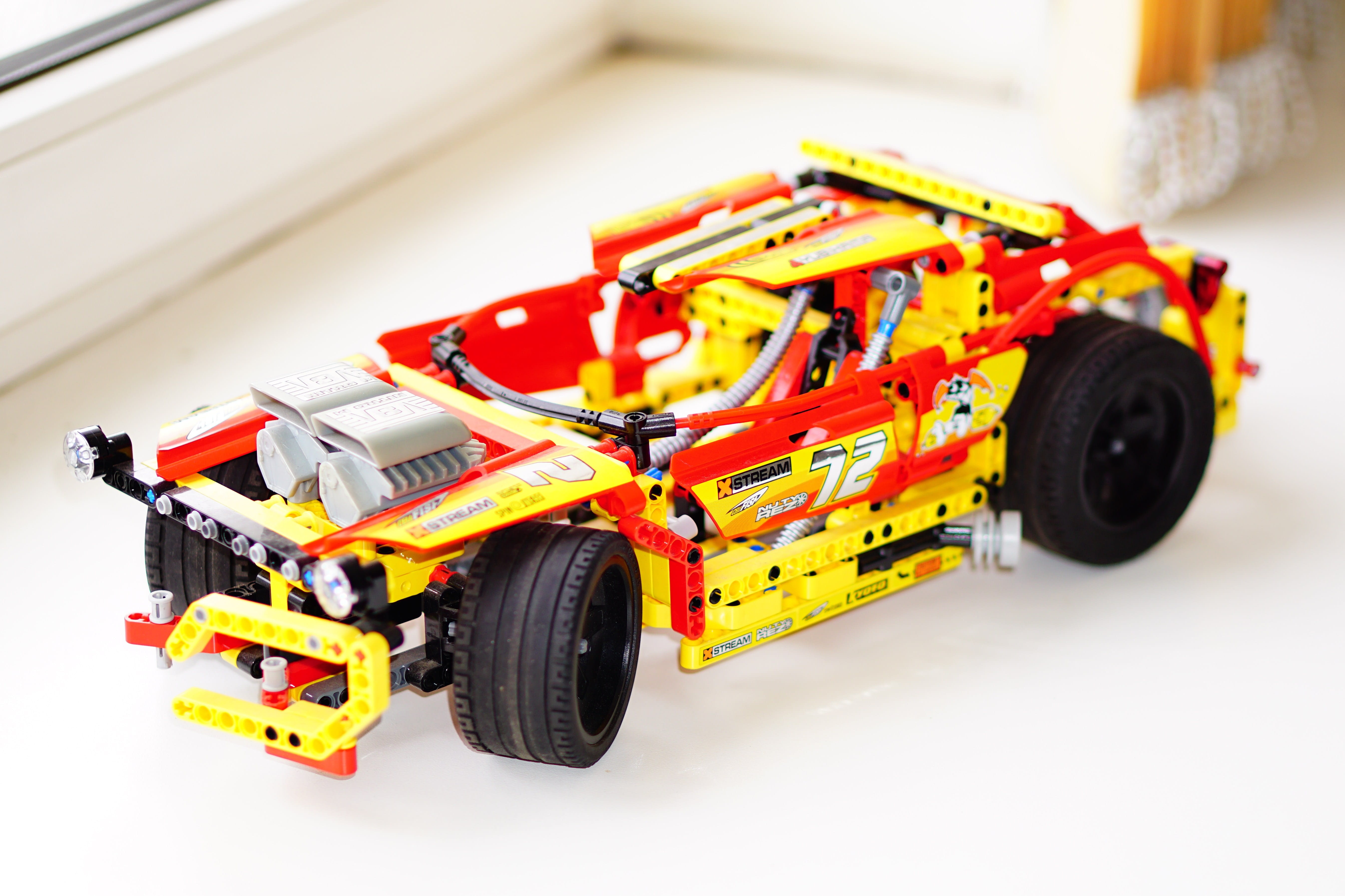 yellow, car, man made object, motorsport, tire, motor vehicle, 5K, truck, indoors, small, white background, Toy, bright, sport, wheel, mode of transportation, HD Wallpaper