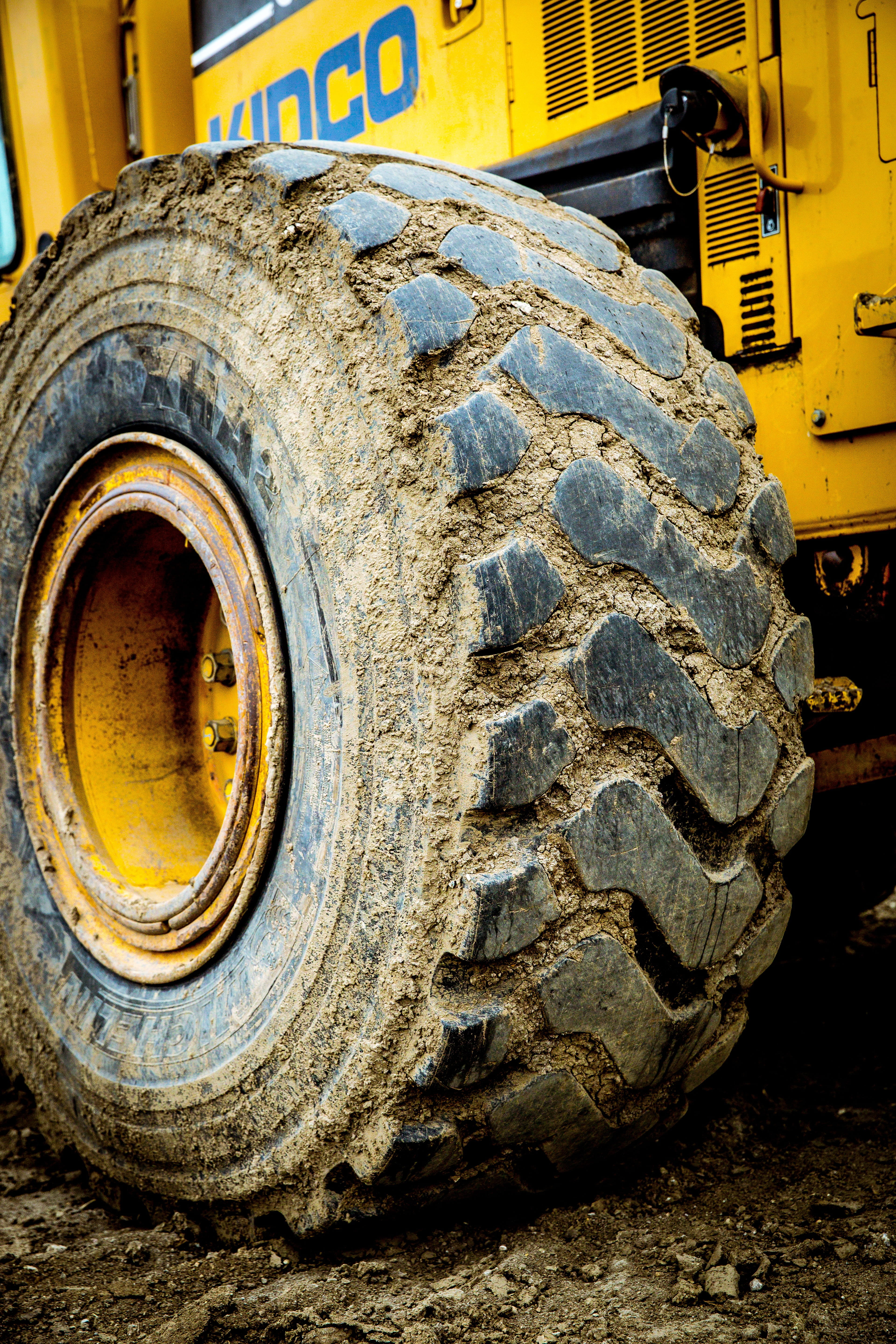 Wheel, tire, close-up, day, mud, yellow, outdoors, metal, construction site, mode of transportation, machinery, dirty, construction industry, tractor, motor vehicle, Phone HD Wallpaper