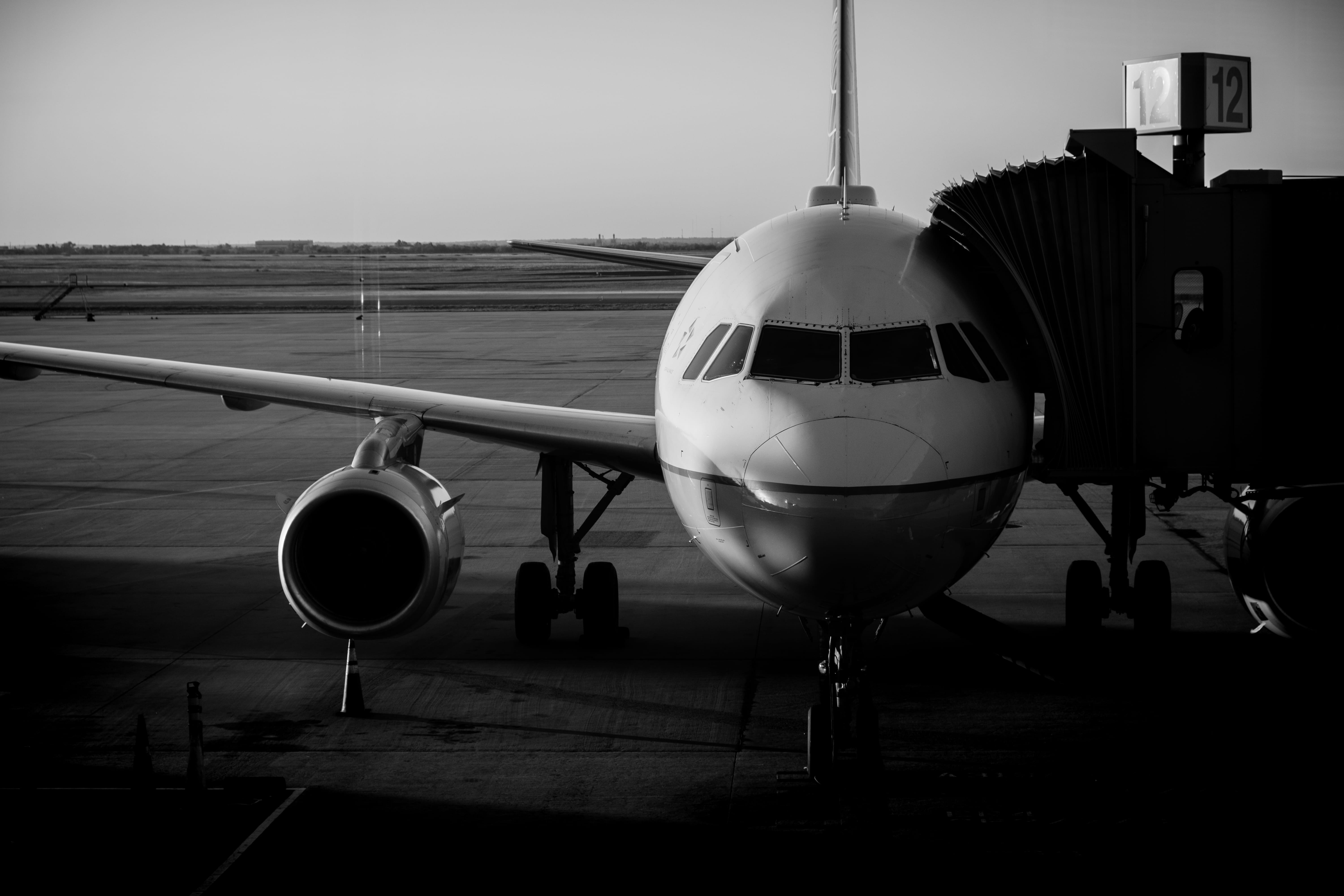 united states, airplane, water, oklahoma, commercial airplane, air vehicle, white, journey, stark, will rogers, black and white, sky, rogers, black, passenger boarding bridge, HD Wallpaper