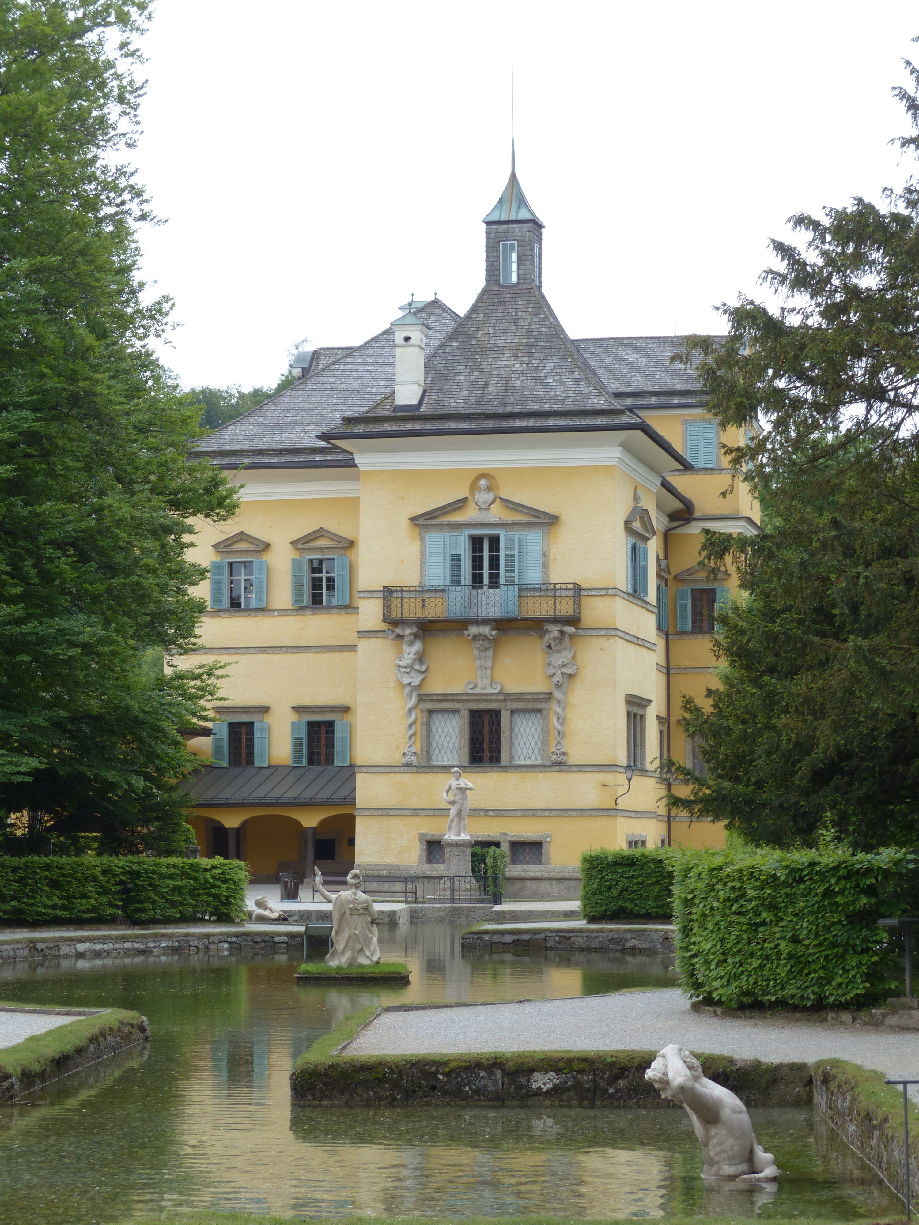 Castle, yellow, 4K, annex, lake, reflection, residential district, waterfront, building, water games, hellbrunn, day, outdoors, tree, no people, architecture, Phone HD Wallpaper