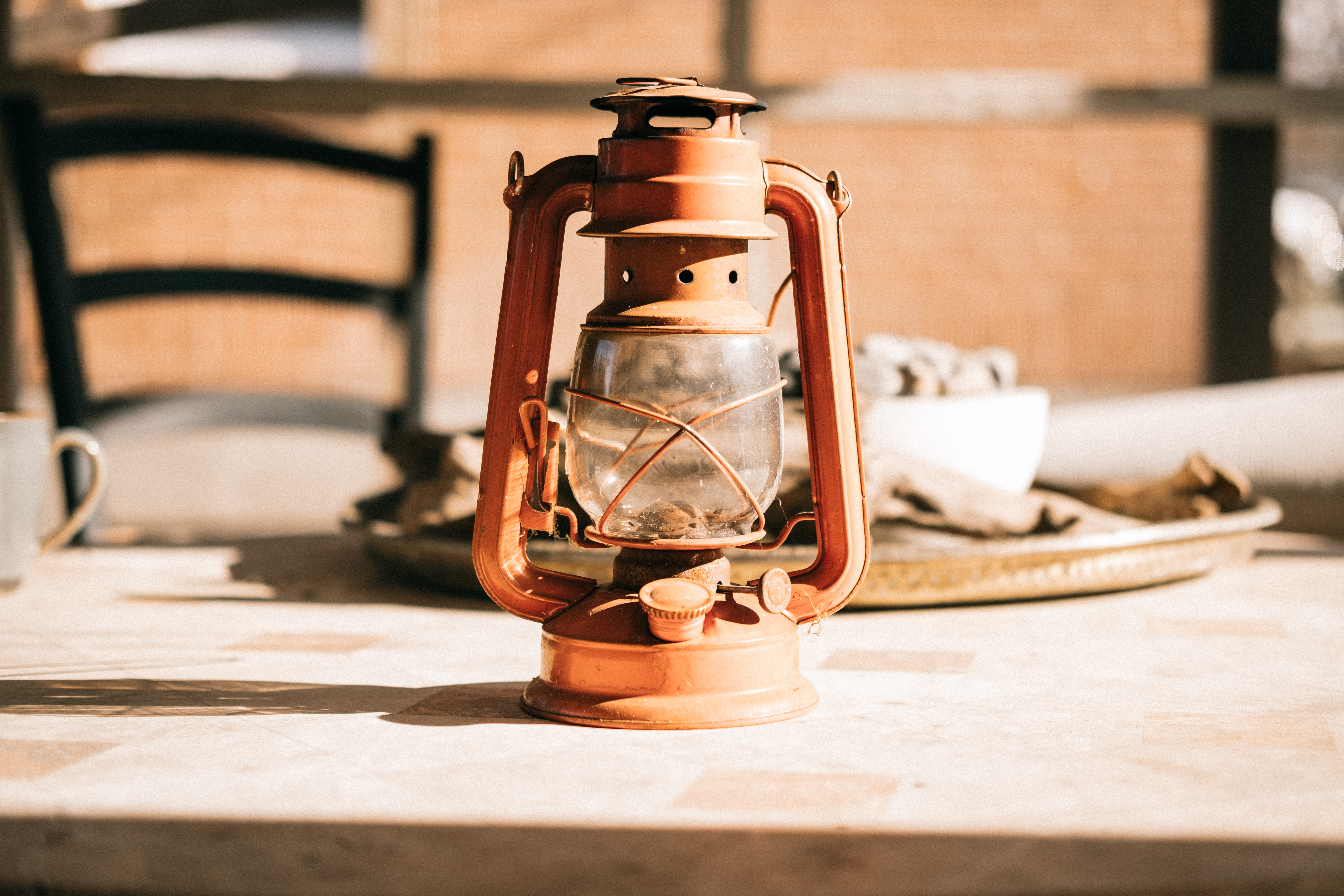 brown, no people, sunlight, lantern, electric lamp, kerosene, antique, 5K, table, glass - material, close-up, shadow, lamp, old, focus on foreground, still life, HD Wallpaper