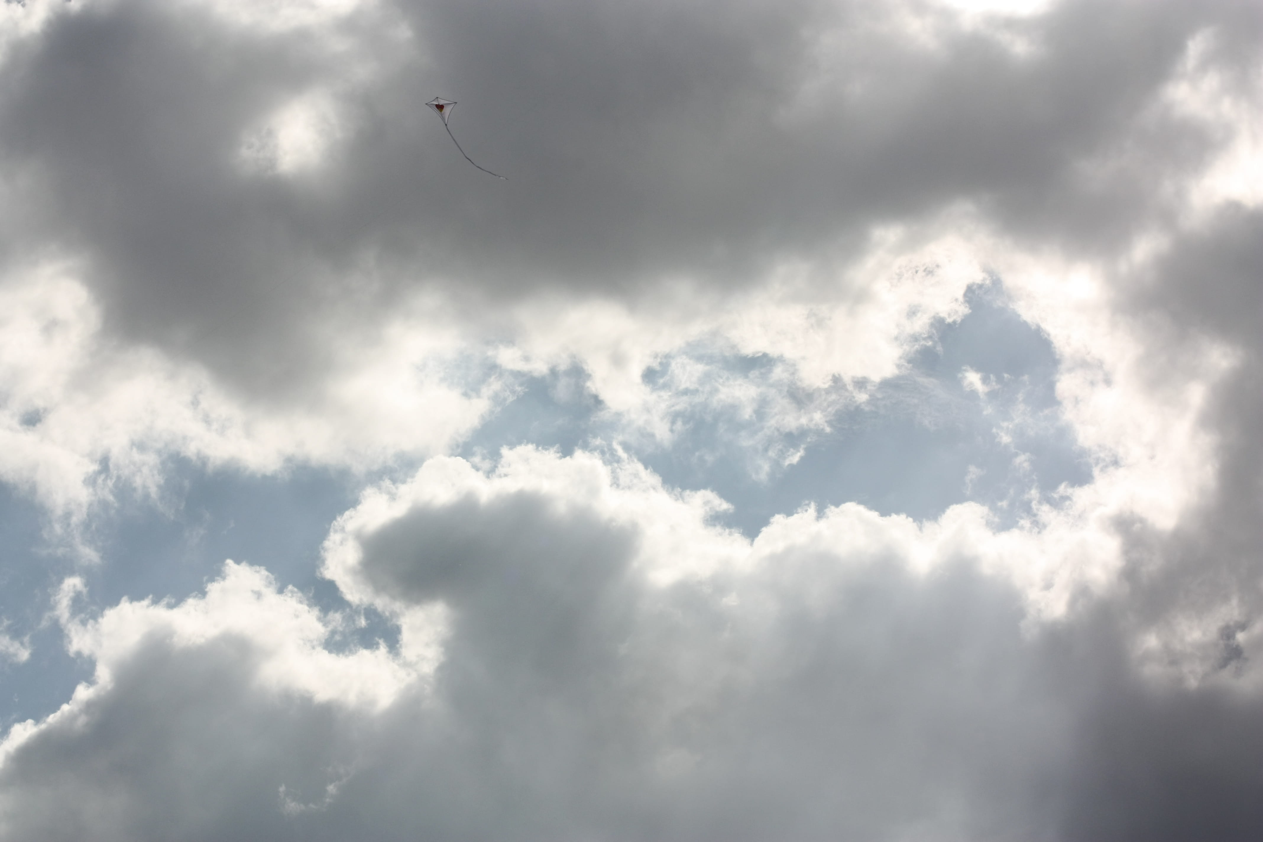 low angle view, beauty in nature, flying, 4K, flag, light, cloudscape, clouds, softness, bird, animal, no people, cloud, toy, outdoors, mid-air, adventure, HD Wallpaper
