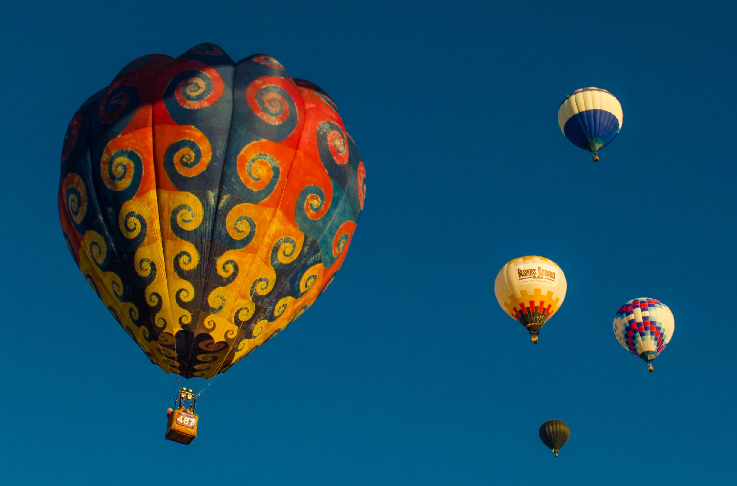 mid-air, blue, mode of transportation, ballooning festival, mexico, flying, sky, travel, low angle view, albuquerque, tie dye, hot air balloon, pattern, HD Wallpaper