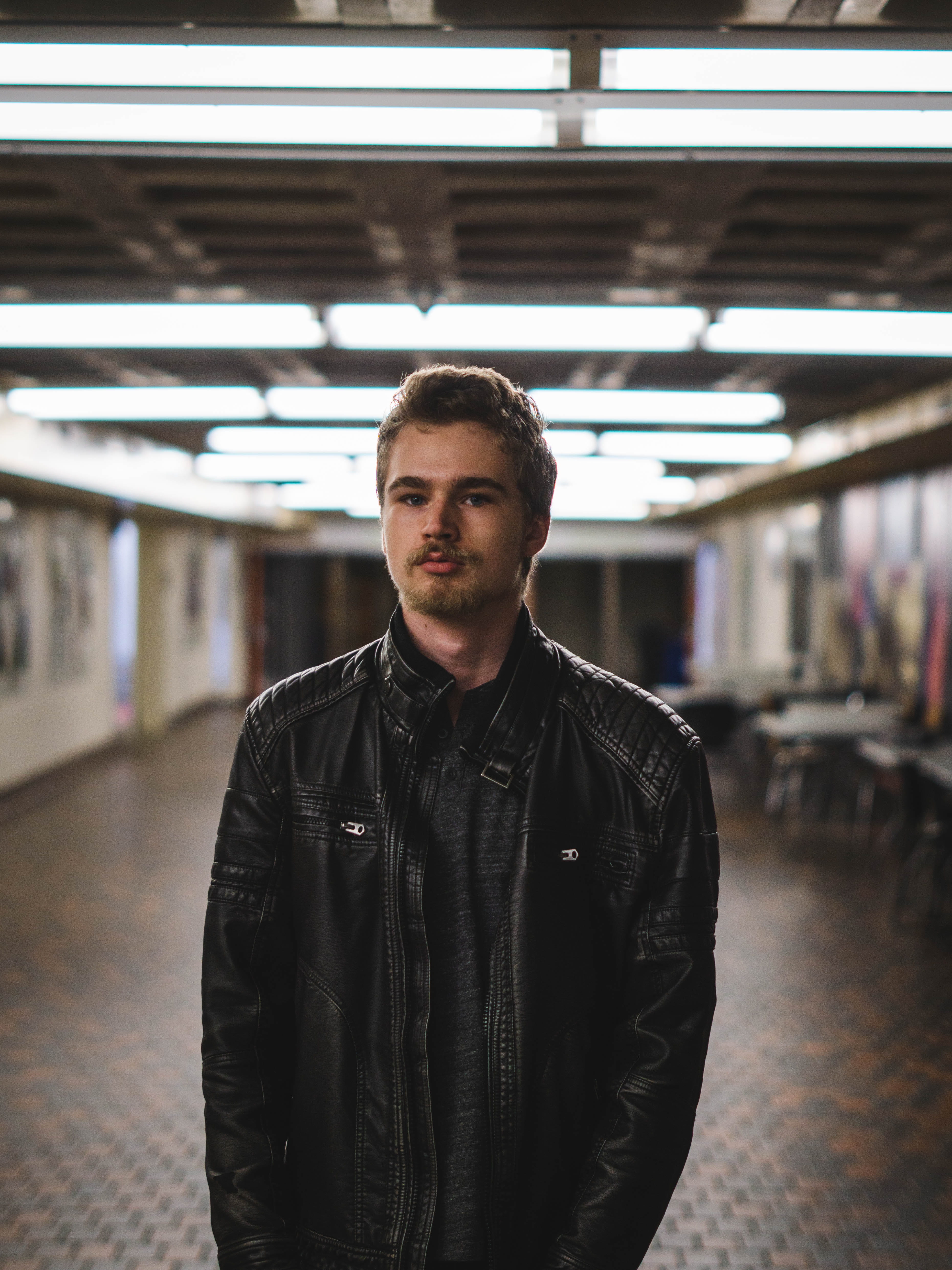 clothing, front view, lighted, leather jacket, warm clothing, coat, leather, young men, men, shadows, apparel, jacket, sleeve, standing, looking at camera, Phone HD Wallpaper