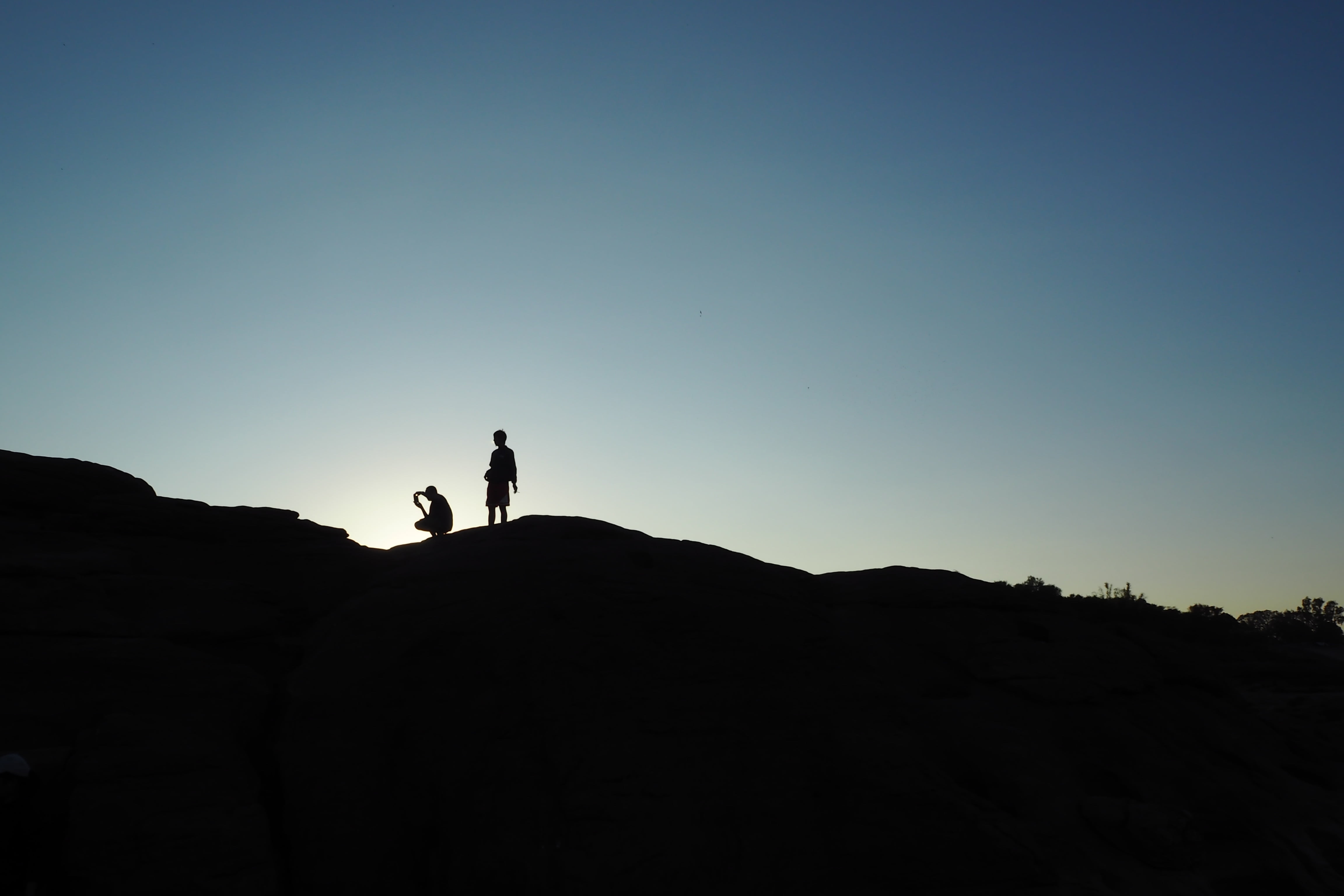 silhouettes, landscape, men, nature, outdoors, high, two people, copy space, black, daytime, environment, people, ridge, standing, person, lifestyles, real people, HD Wallpaper