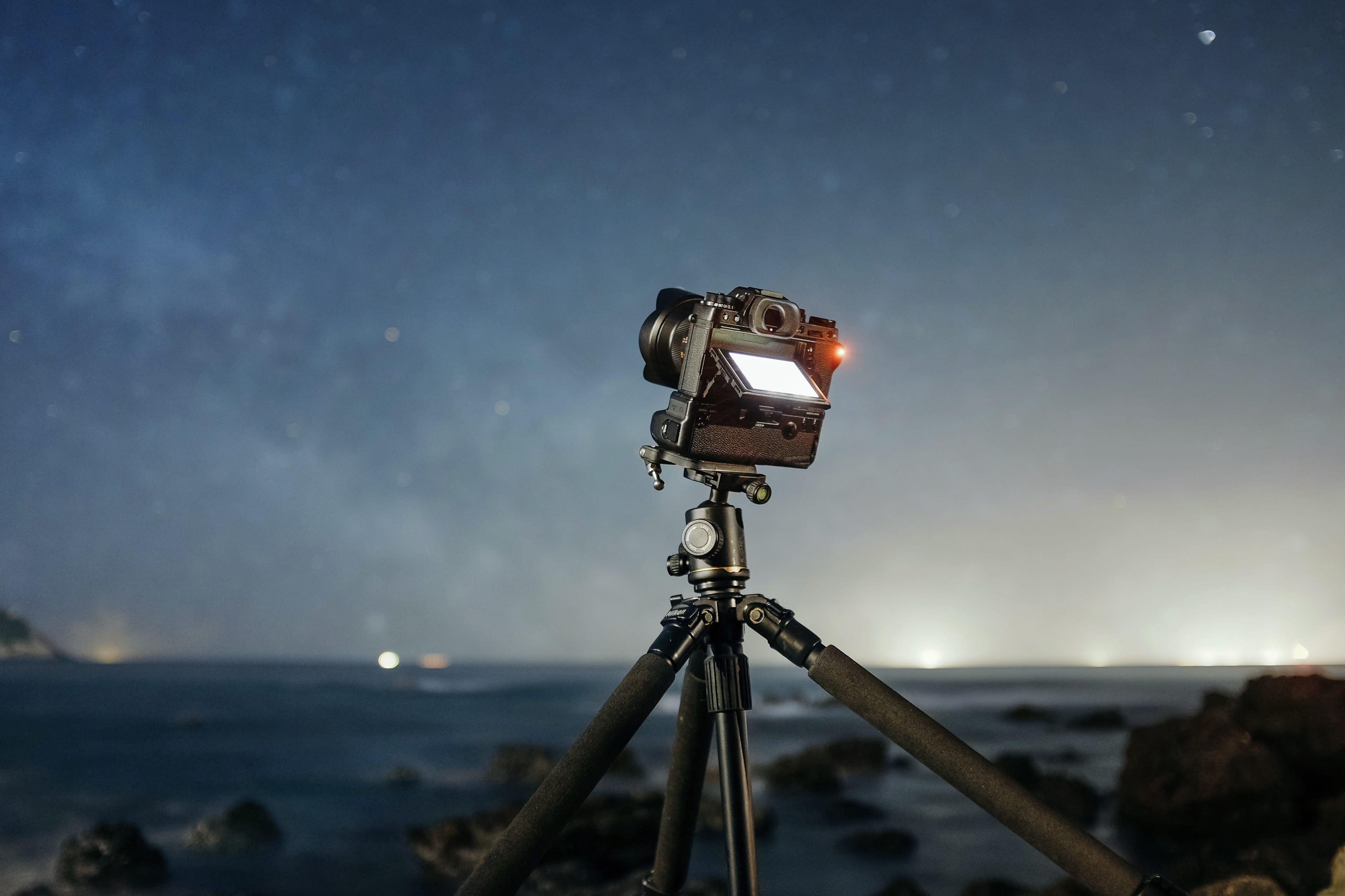 night, outdoors, star, camera, light, digital camera, no people, slr camera, home video camera, nature, twinkle, 2K, go, sea, technology, film industry, HD Wallpaper