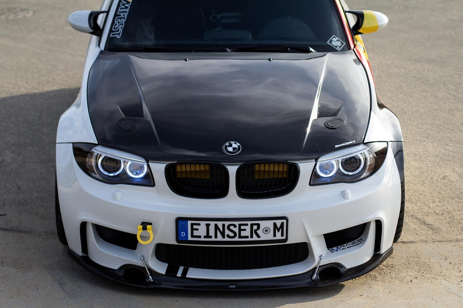 close-up, motor vehicle, retro styled, outdoors, text, city, bmw m1 coupe raze car, day, front view, high angle view, car, transportation, security, 720P, HD Wallpaper
