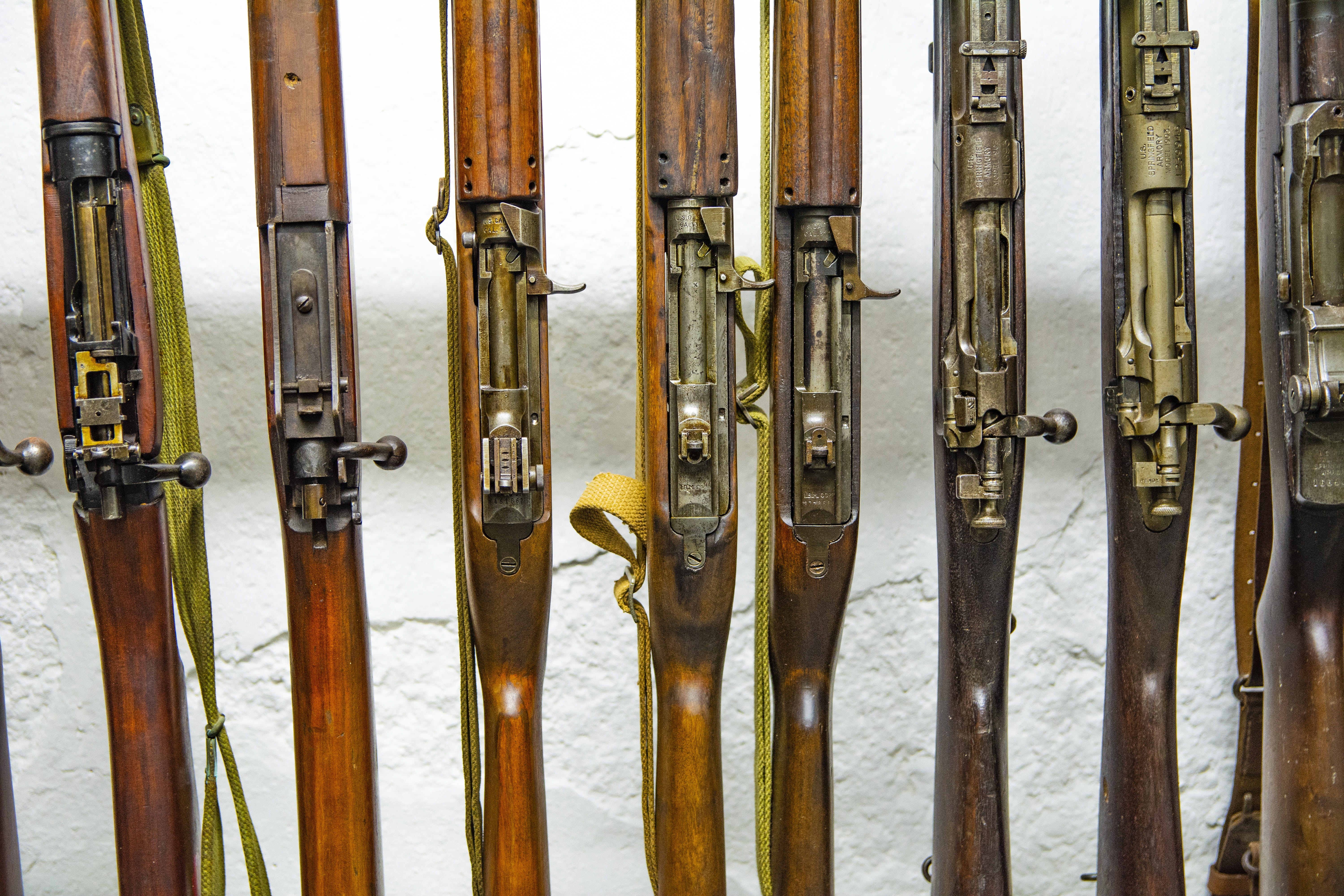 no people, side by side, guns, barrier, in a row, security, handgun, cannon, group of objects, 5K, close-up, wood - material, weapon, metal, backgrounds, HD Wallpaper