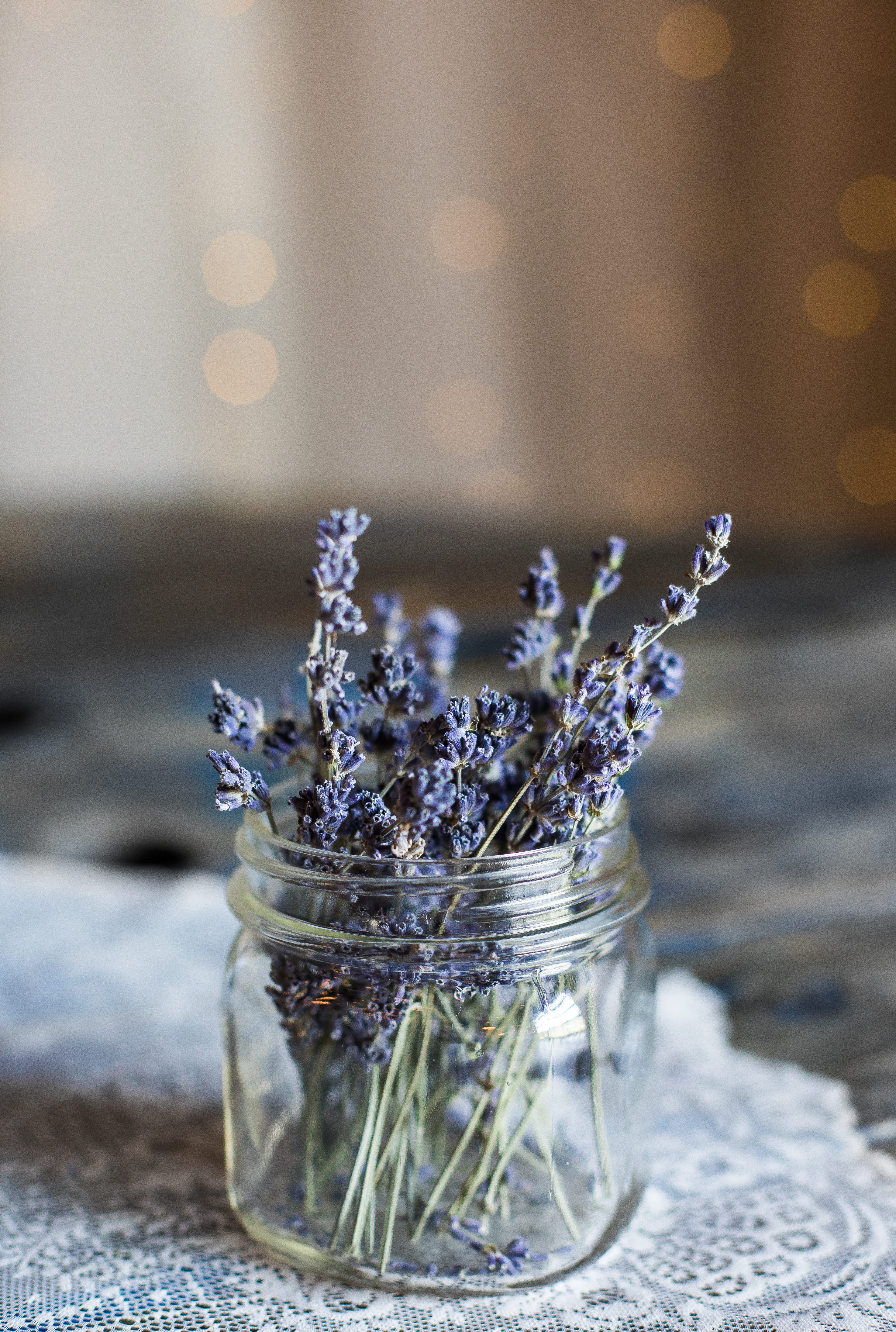 jar, food and drink, bokeh, table, food, petaled, comfort, selective focus, nature, crockery, wellbeing, flower, plant, closeup, blue, indoors, glass, crystal glassware, Phone HD Wallpaper
