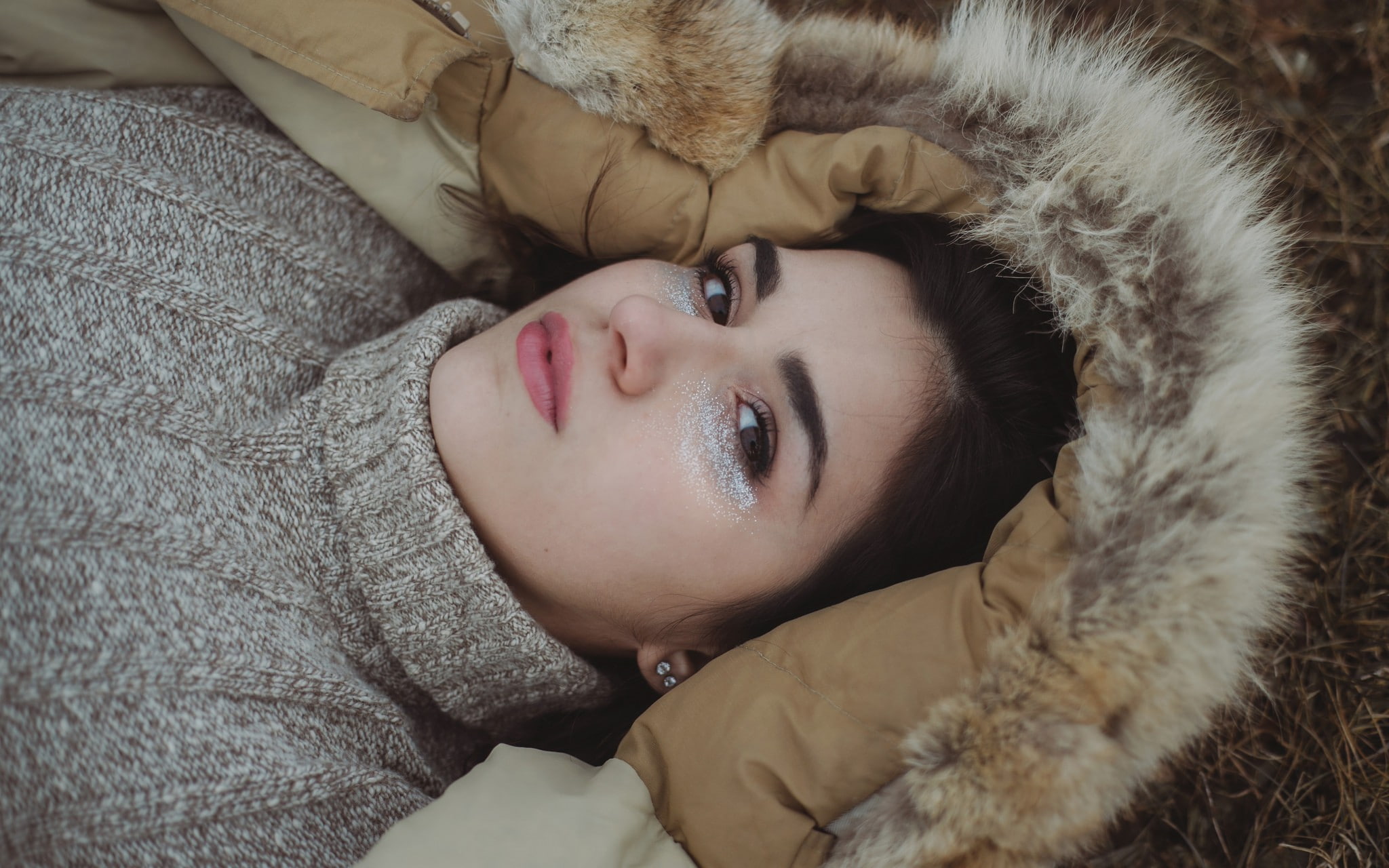 makeup, women, brunette, 1080P, brown eyes, pale, hoods, sweater, looking at viewer, lying on back, HD Wallpaper