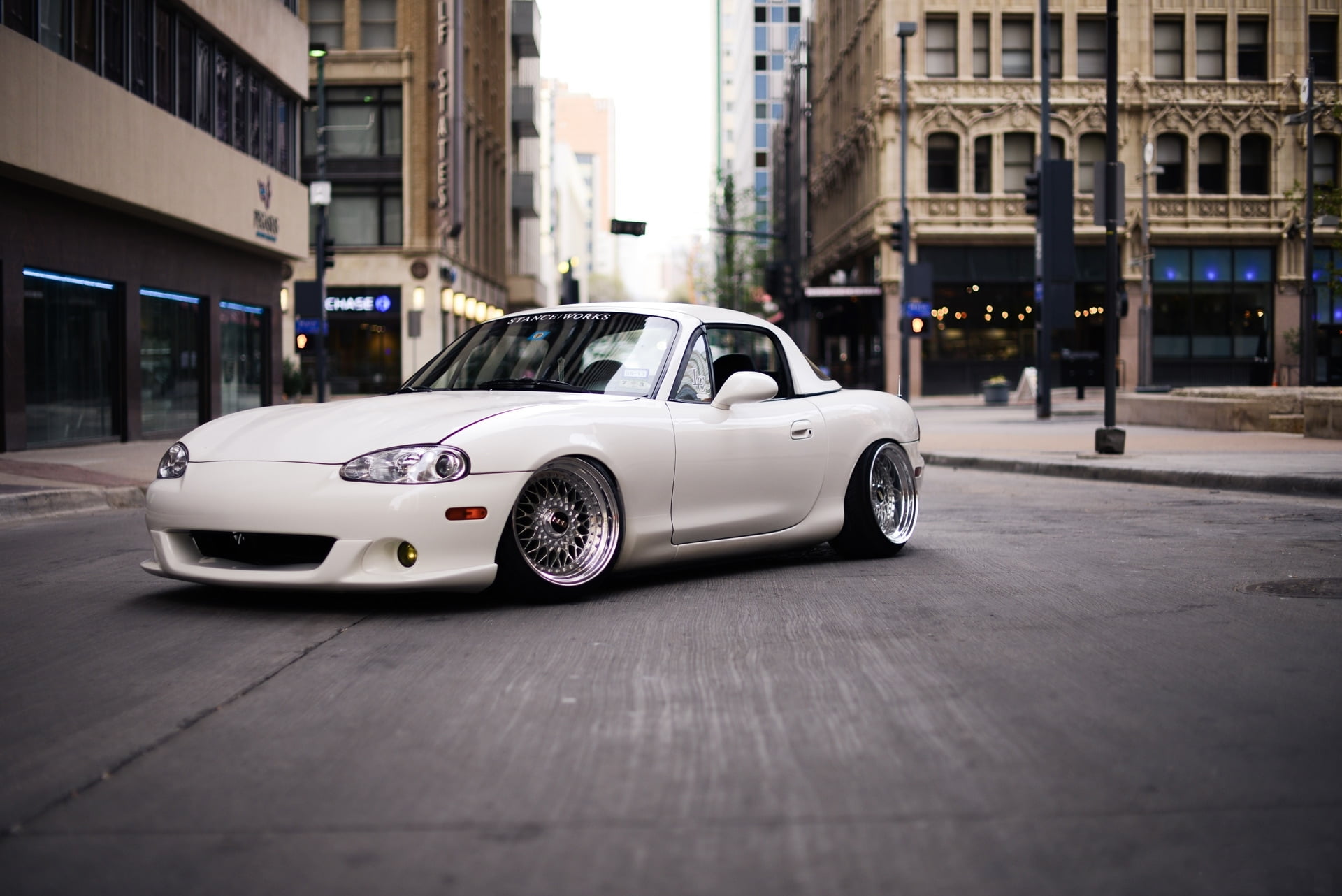 on the move, no people, motor vehicle, city life, city street, car, luxury, land vehicle, building exterior, Mazda, outdoors, selective focus, white, architecture, HD Wallpaper