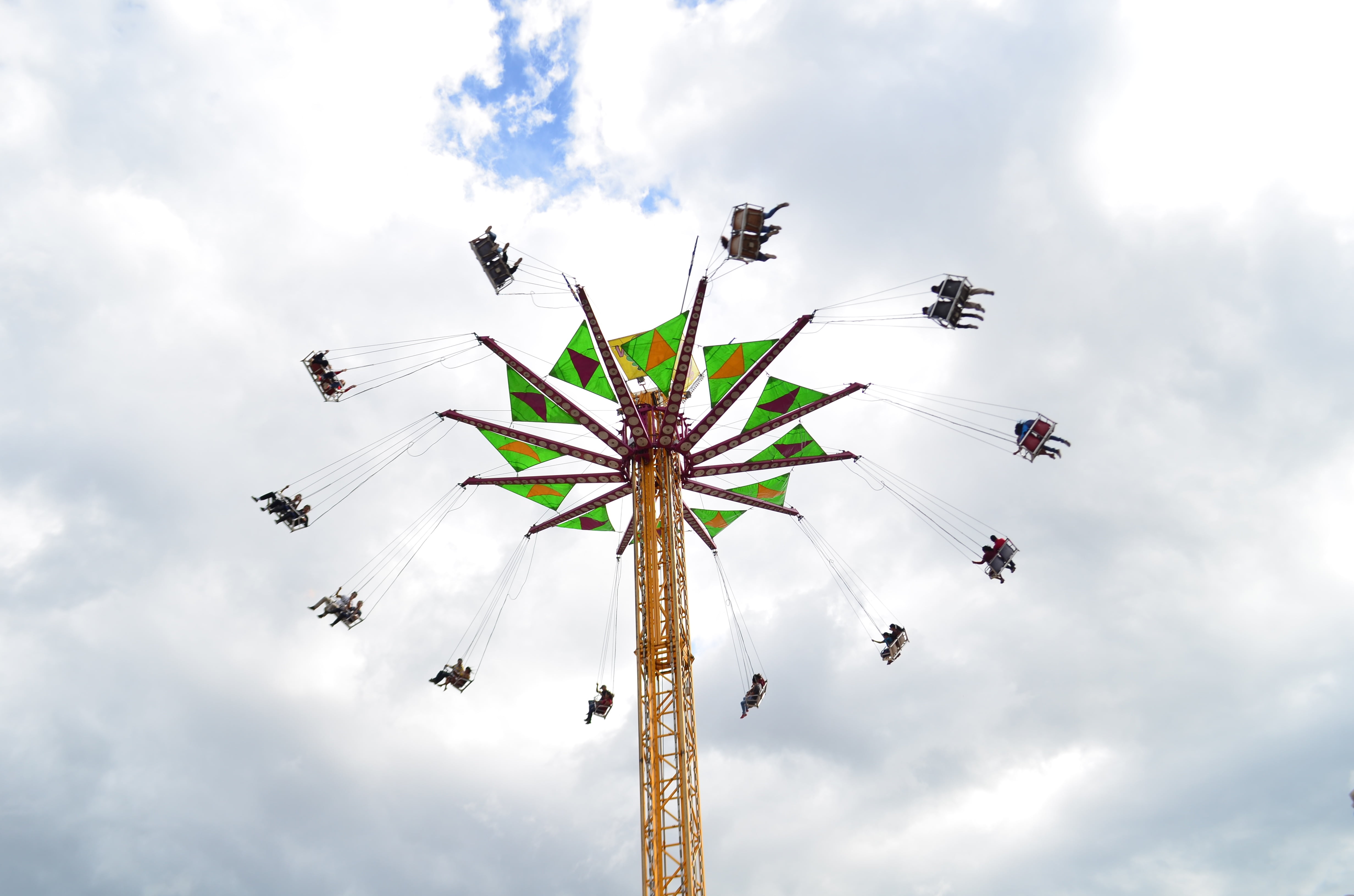 arts culture and entertainment, spinning, chain swing ride, carnival, excitement, day, sky, low angle view, high up, group of people, amusement park, fun, HD Wallpaper