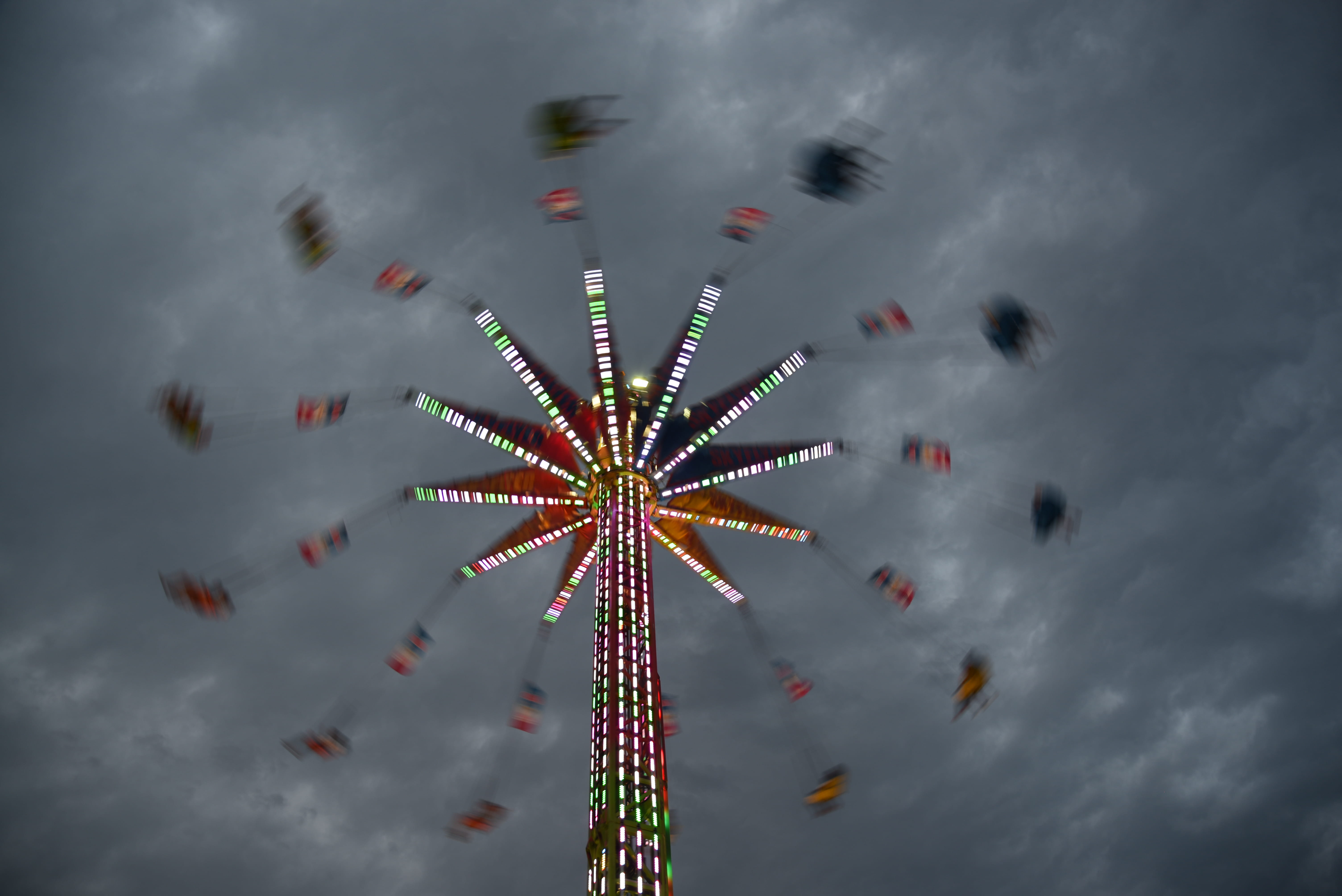 motion, outdoors, red, low angle view, blue, cloudy, park, festival, multi colored, 5K, leisure activity, nature, no people, ride, grey sky, enjoyment, HD Wallpaper