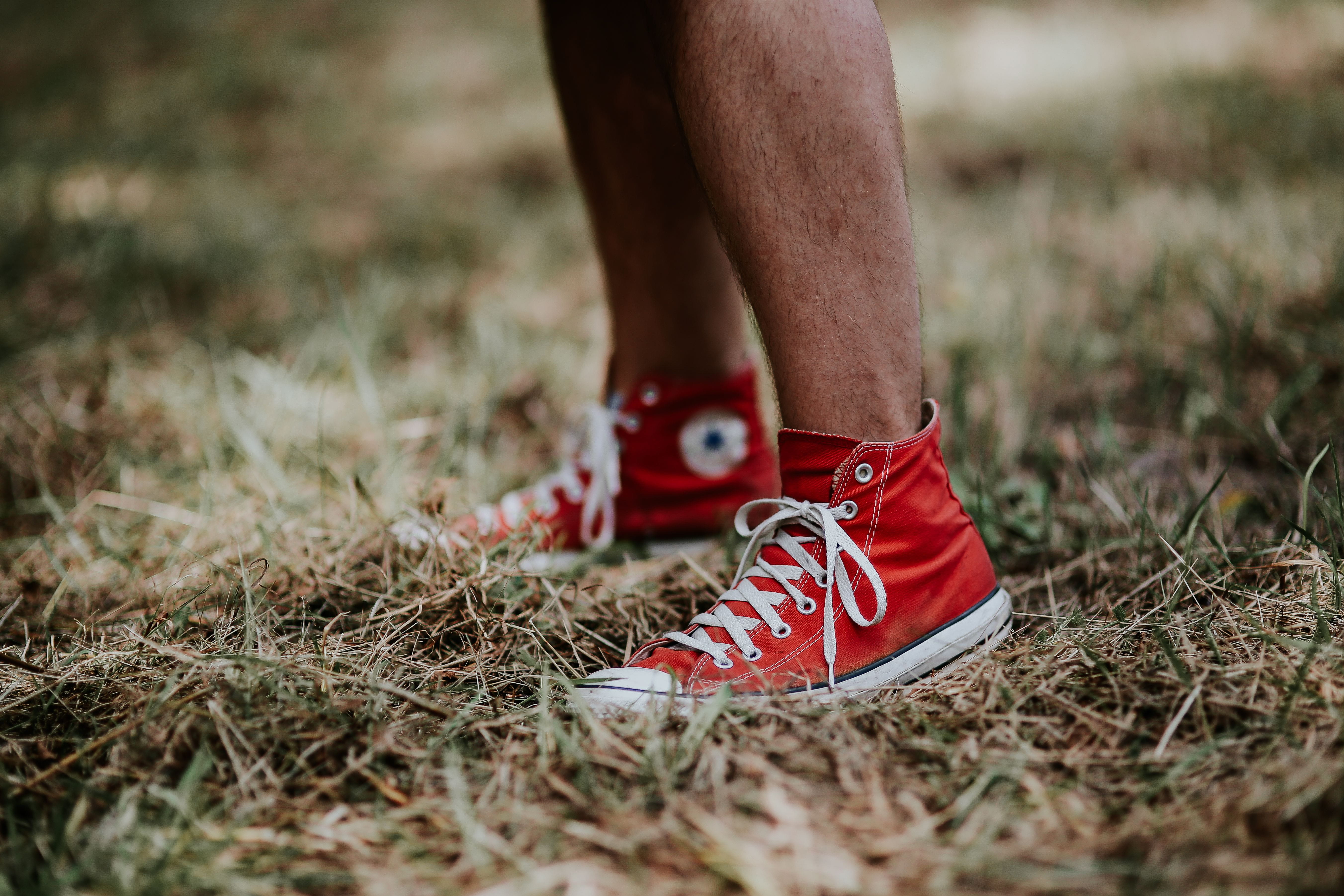 adult, limb, standing, lifestyles, red, human body part, day, outdoors, plant, nature, body part, human leg, selective focus, sneaker, shoe, 5K, leisure activity, HD Wallpaper