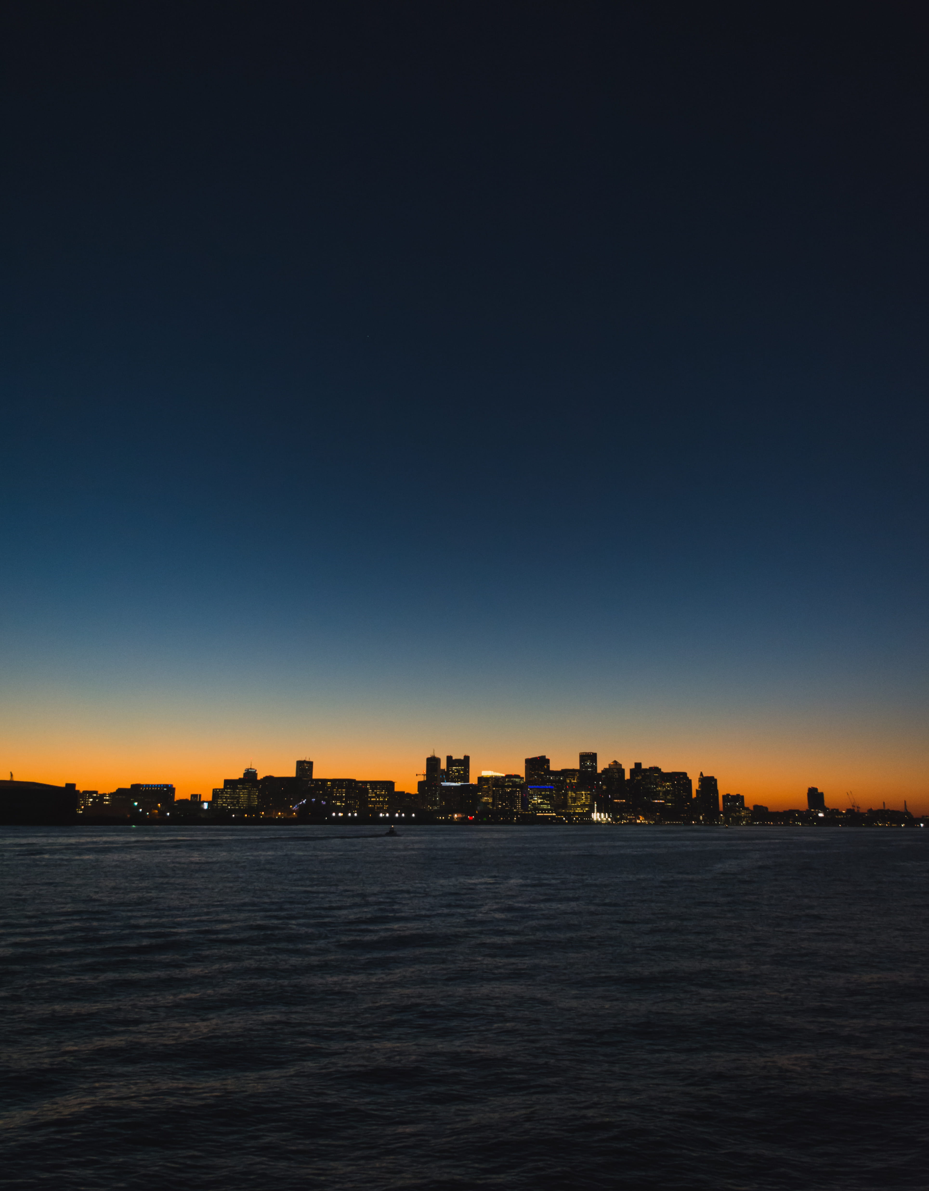 city, view into land, no people, tranquil scene, sunset, silhouette, skyline, built structure, skyscrapers, skyscraper, cityscape, building exterior, harbor, Phone HD Wallpaper