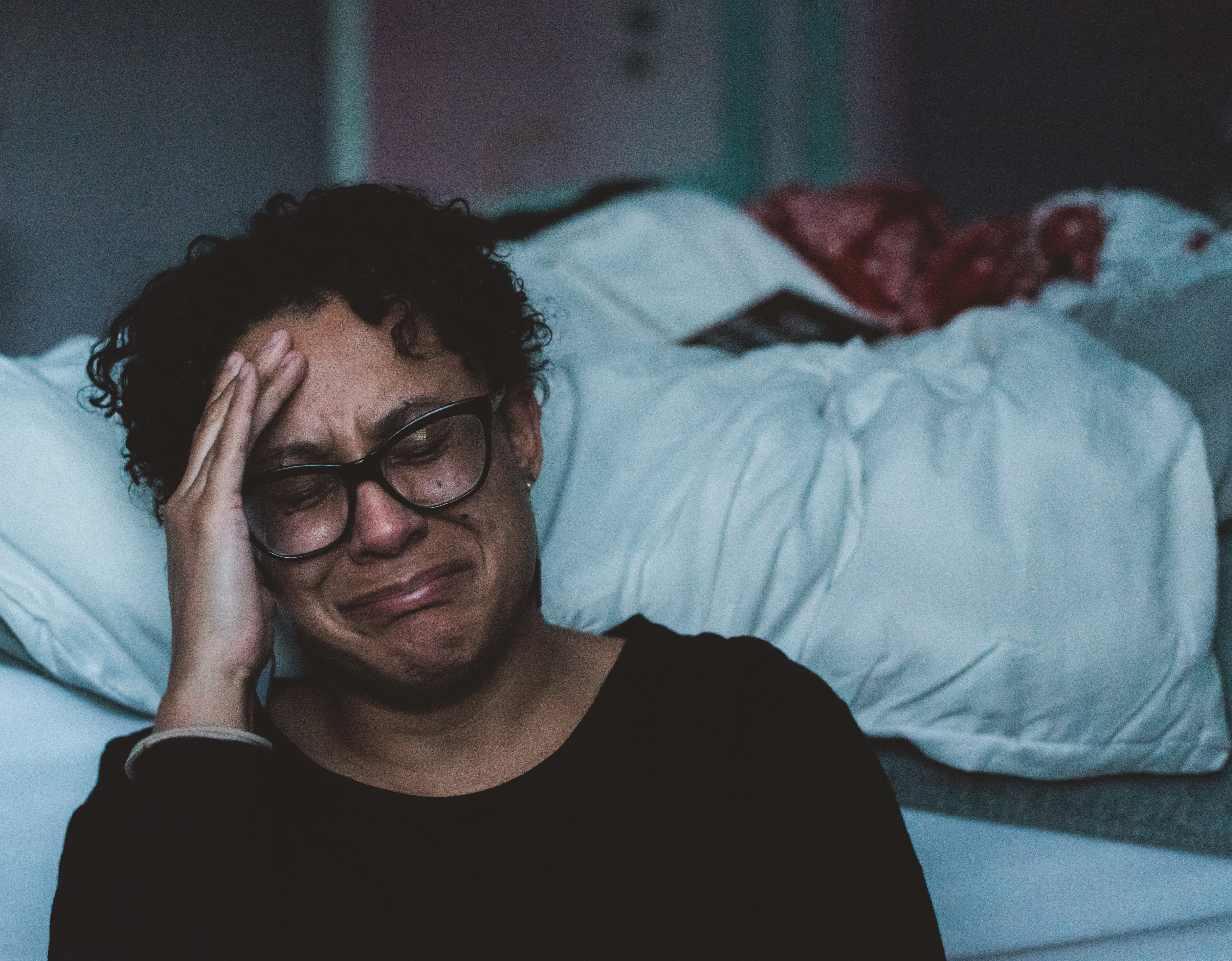 indoors, african american, bed, adult, men, man, lifestyles, holding, head, black hair, gray, portrait, eyes closed, 5K, one person, glasses, real people, HD Wallpaper