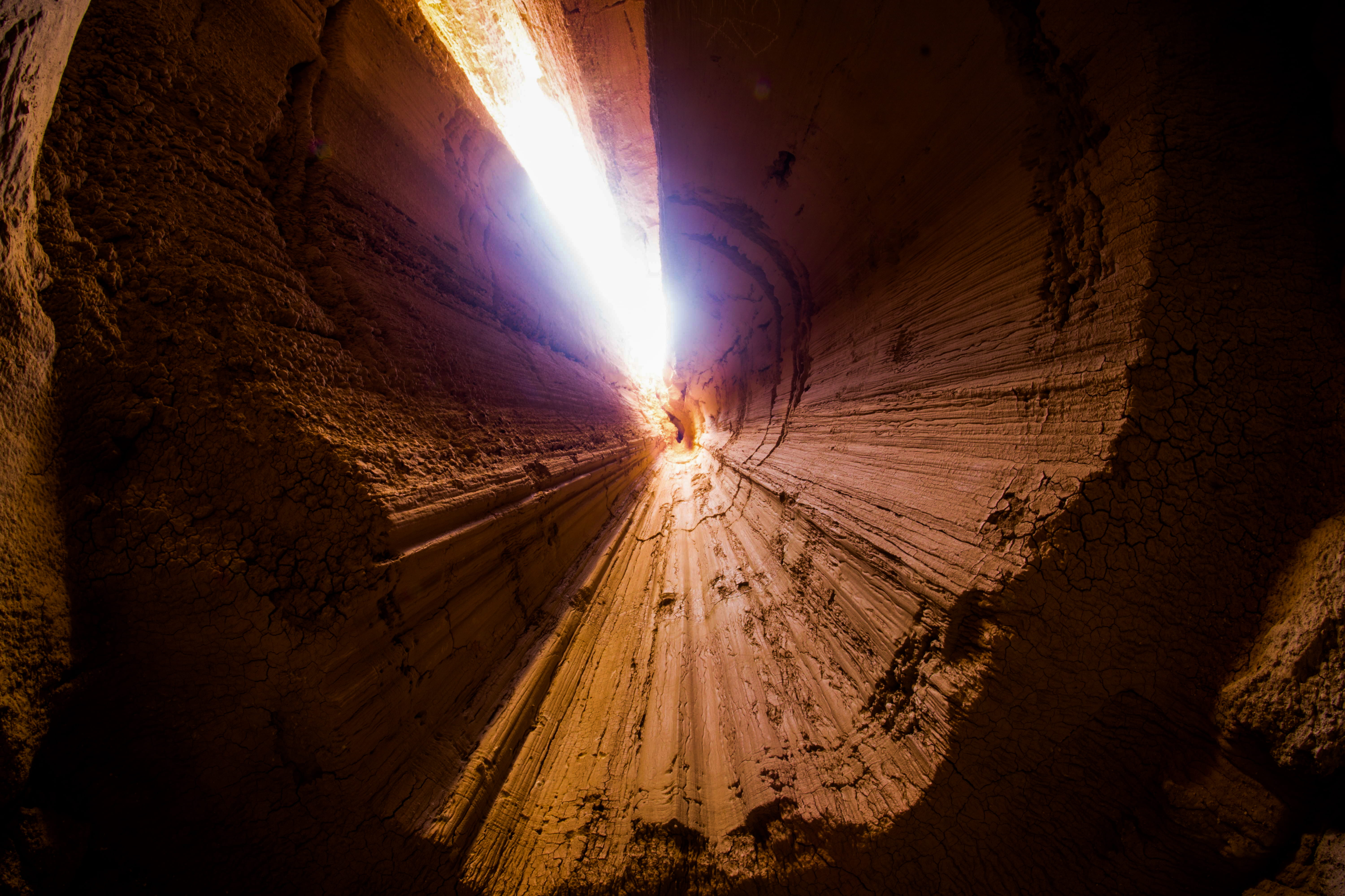 dirt, outdoors, photo, light - natural phenomenon, eye, road, cave, lens flare, light, daytime, angle, low, rock, sunlight, sky, architecture, view, tunnel, HD Wallpaper