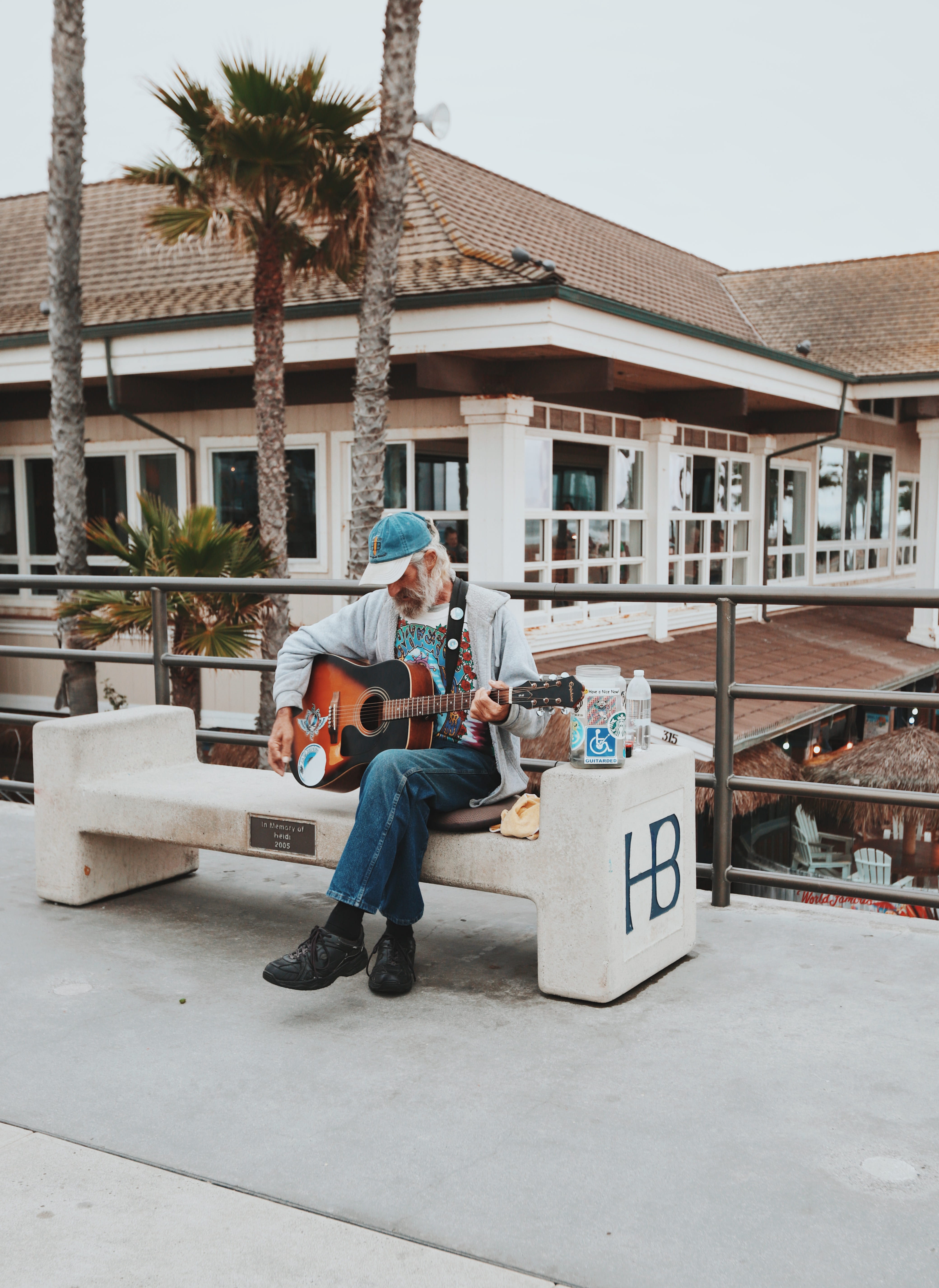 building, outdoor, huningtonbeach, sits, one person, white, outdoors, sidewalk, music, daytime, beard, young adult, day, palm tree, disabled, guitar, brown, Phone HD Wallpaper