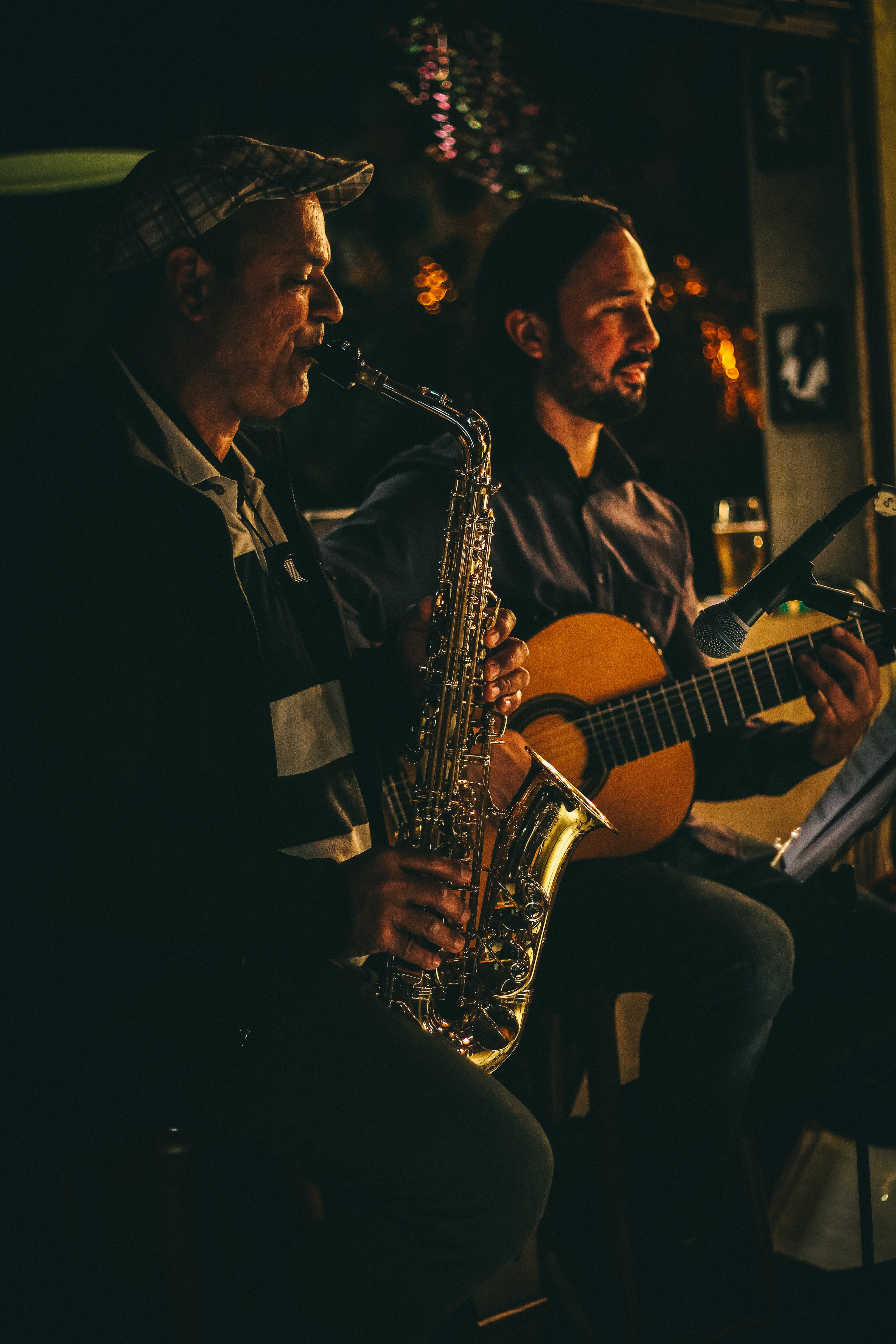 two people, holding, saxphone, guitar, togetherness, stage, sax, people, saxophone, music, real people, artist, 4K, sitting, musical instrument, musical equipment, Phone HD Wallpaper