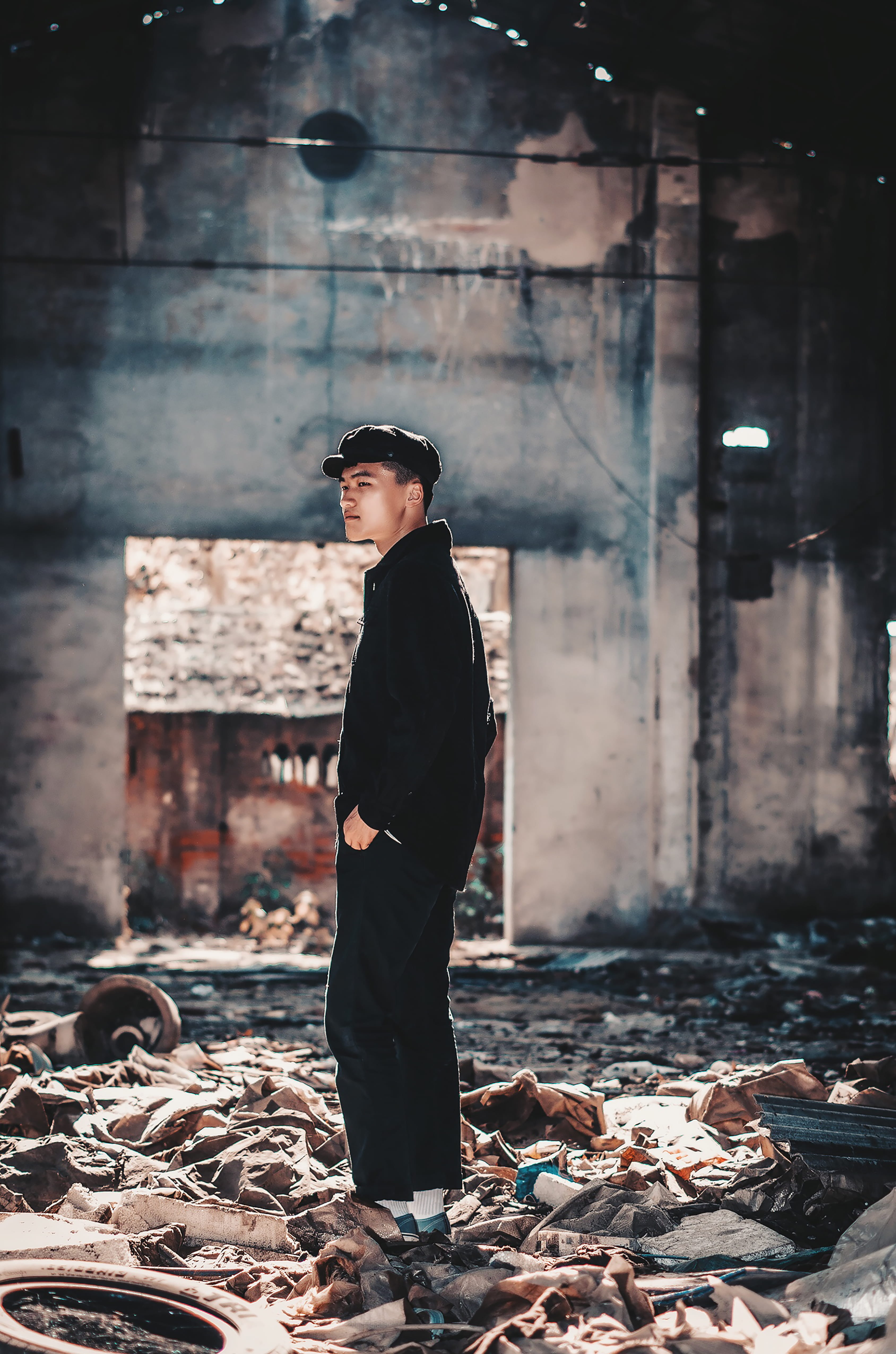 males, shirt, outdoors, urban Scene, street, serious, person, standing, factory, fashion, style, black, sleeved, young Adult, adult, man, warehouse, hat, Phone HD Wallpaper
