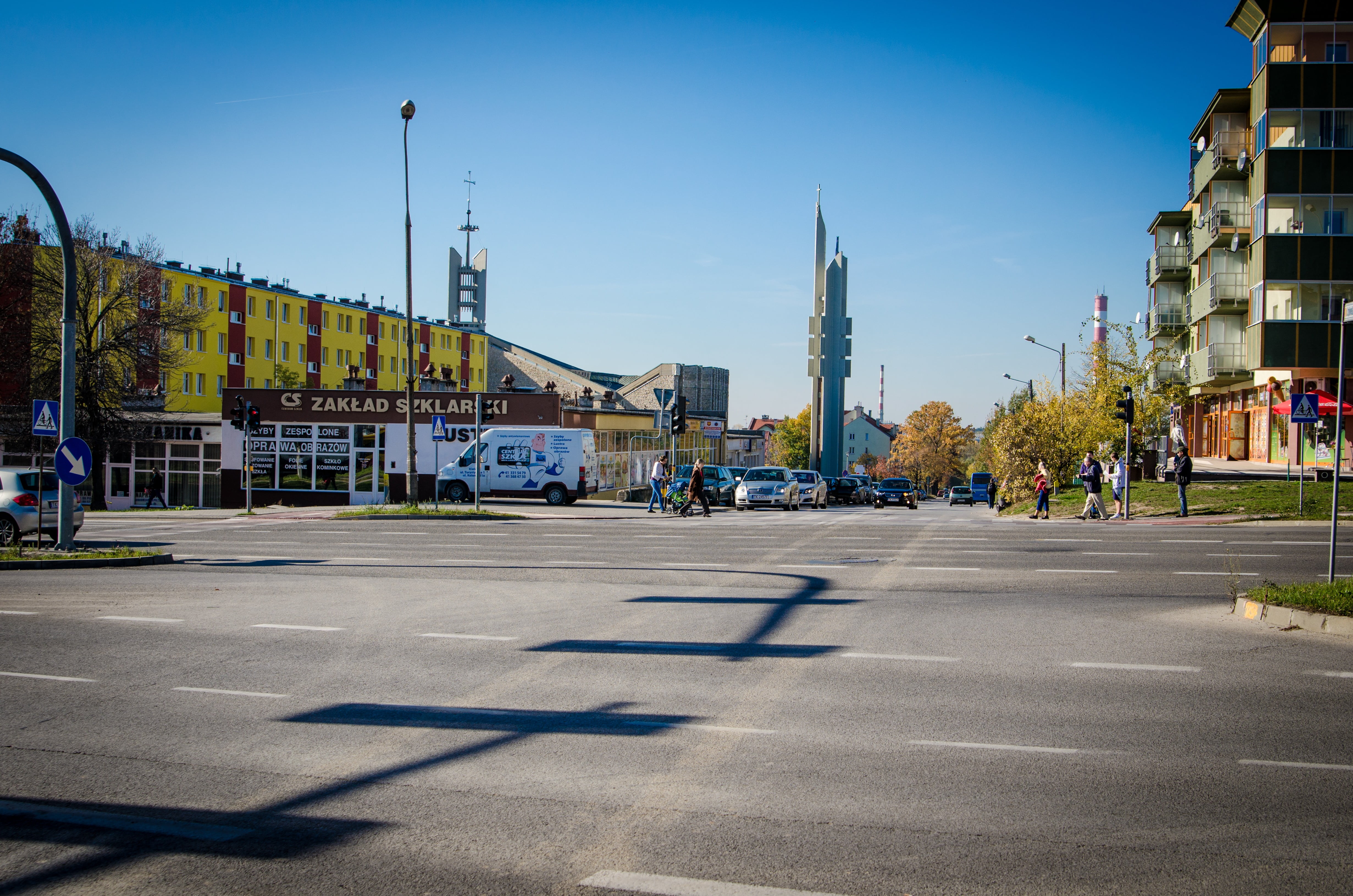 sunlight, sign, building, sky, city street, city, day, tree, street, building exterior, road marking, church, outdoors, road, poland, architecture, tower, HD Wallpaper