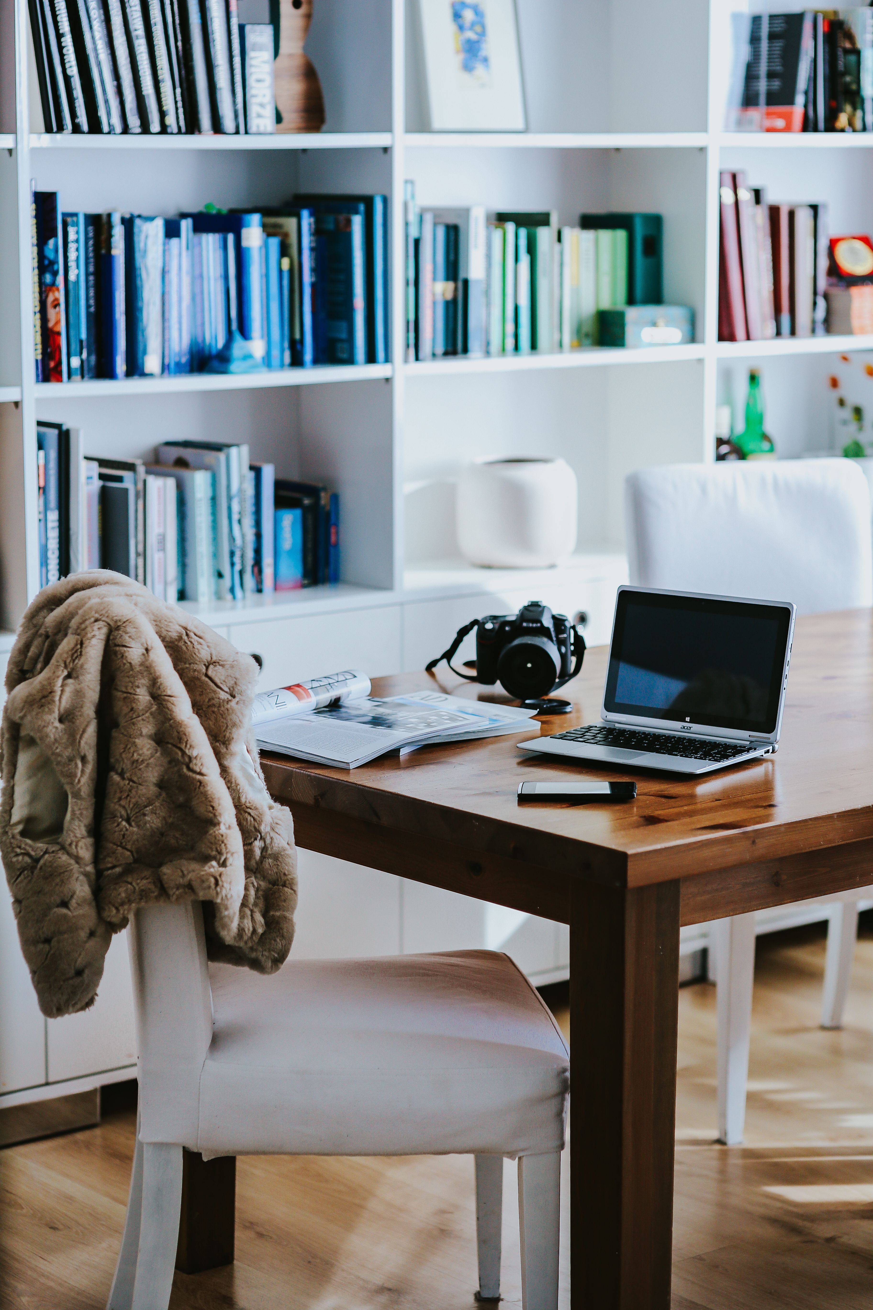 seat, items, wireless technology, modern, book, decor, business, indoors, chair, table, 5K, office, publication, shelf, various, furniture, focus on foreground, Phone HD Wallpaper