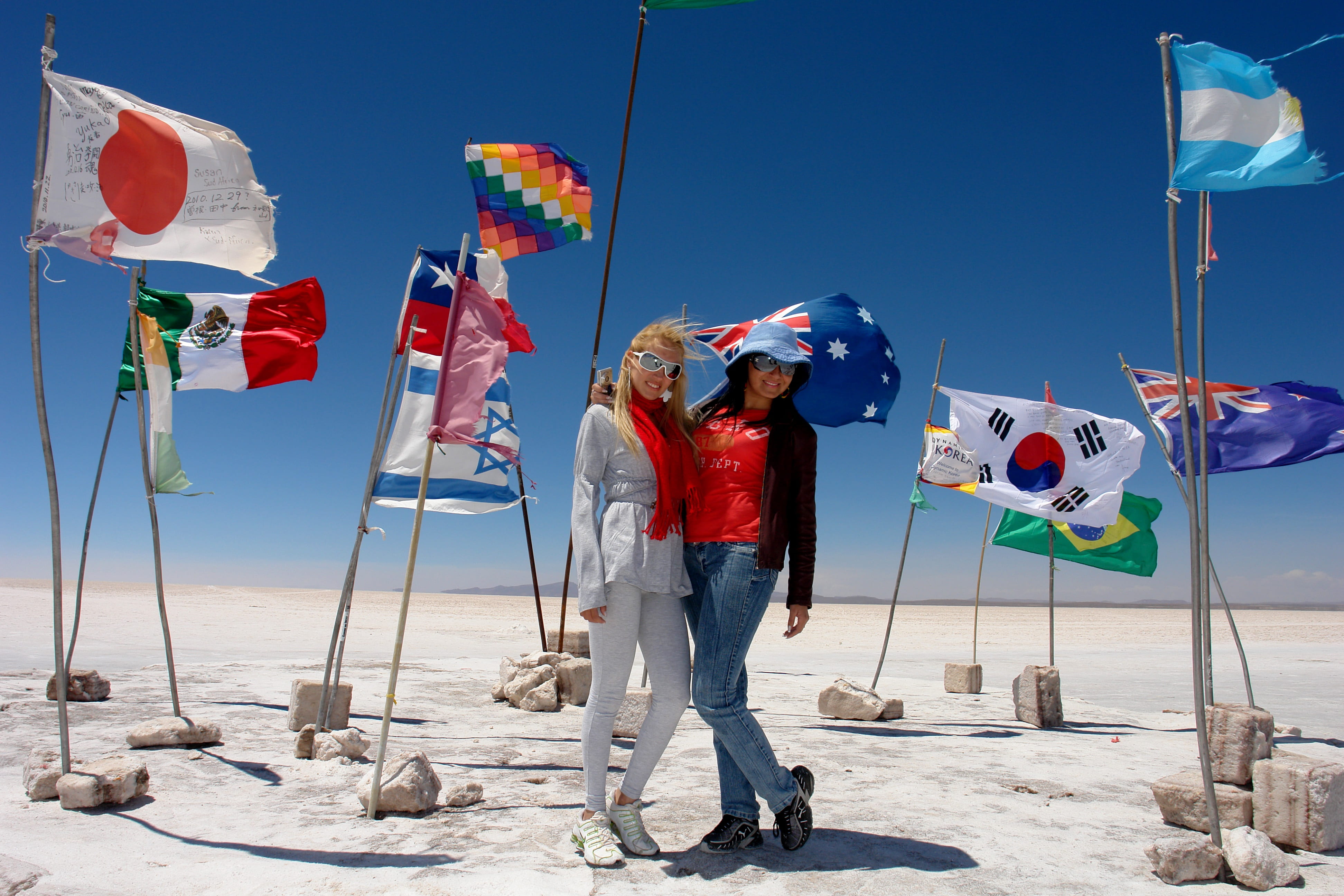 sky, architecture, males, holding, women, wind, salt, outdoors, tourism, flag, salar uyuni, holiday, leisure activity, travel, land, clear sky, flags, blue, HD Wallpaper