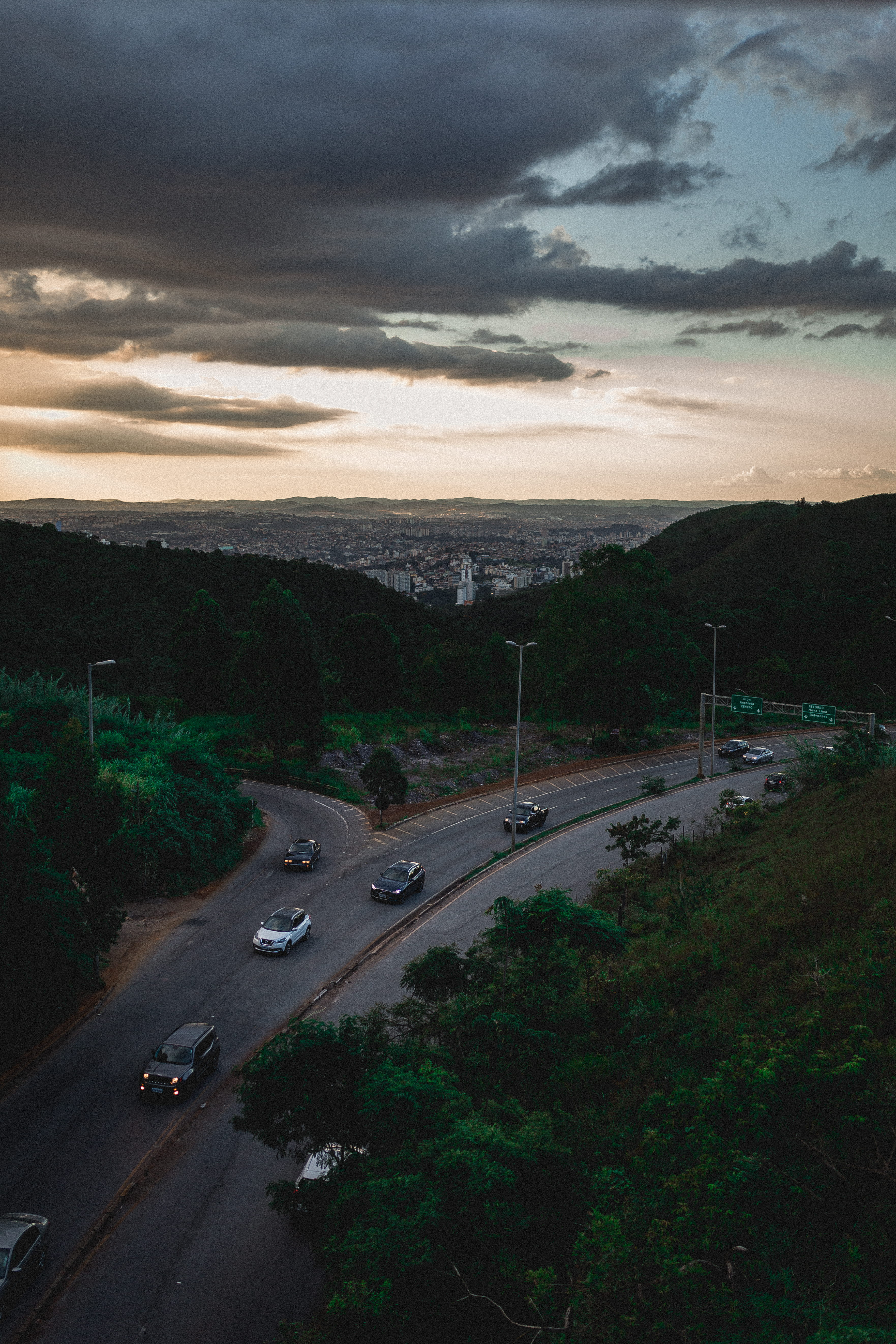 dusk, cloud - sky, outdoors, mode of transportation, 5K, motor vehicle, trees, sunset, evening, transportation system, sky, city, overcast, pavement, asphalt, Phone HD Wallpaper