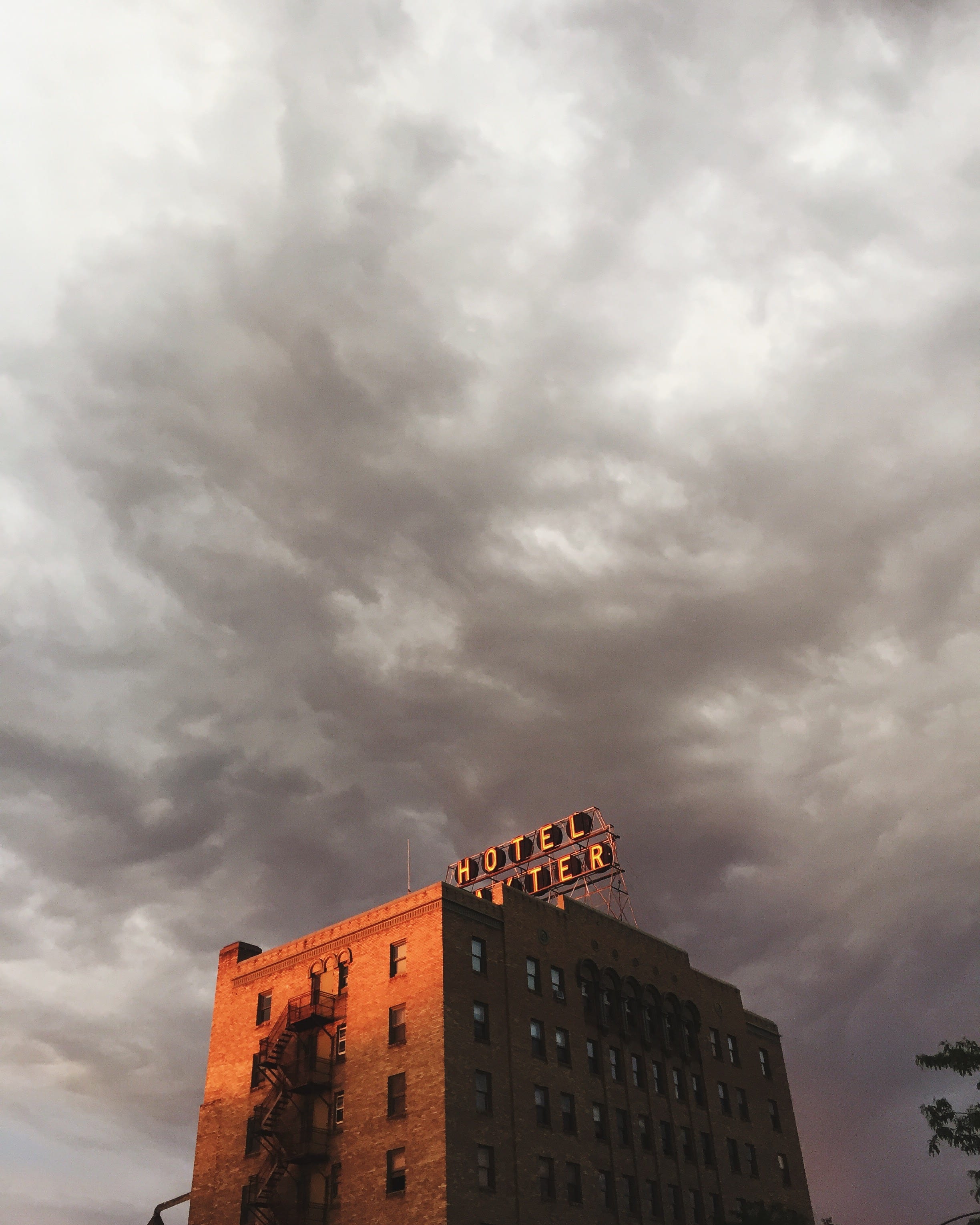 low angle view, outdoors, residential district, cloudy, storm cloud, building, montana, ominous, gloomy, sky, day, storm, sign, overcast, dramatic sky, Phone HD Wallpaper