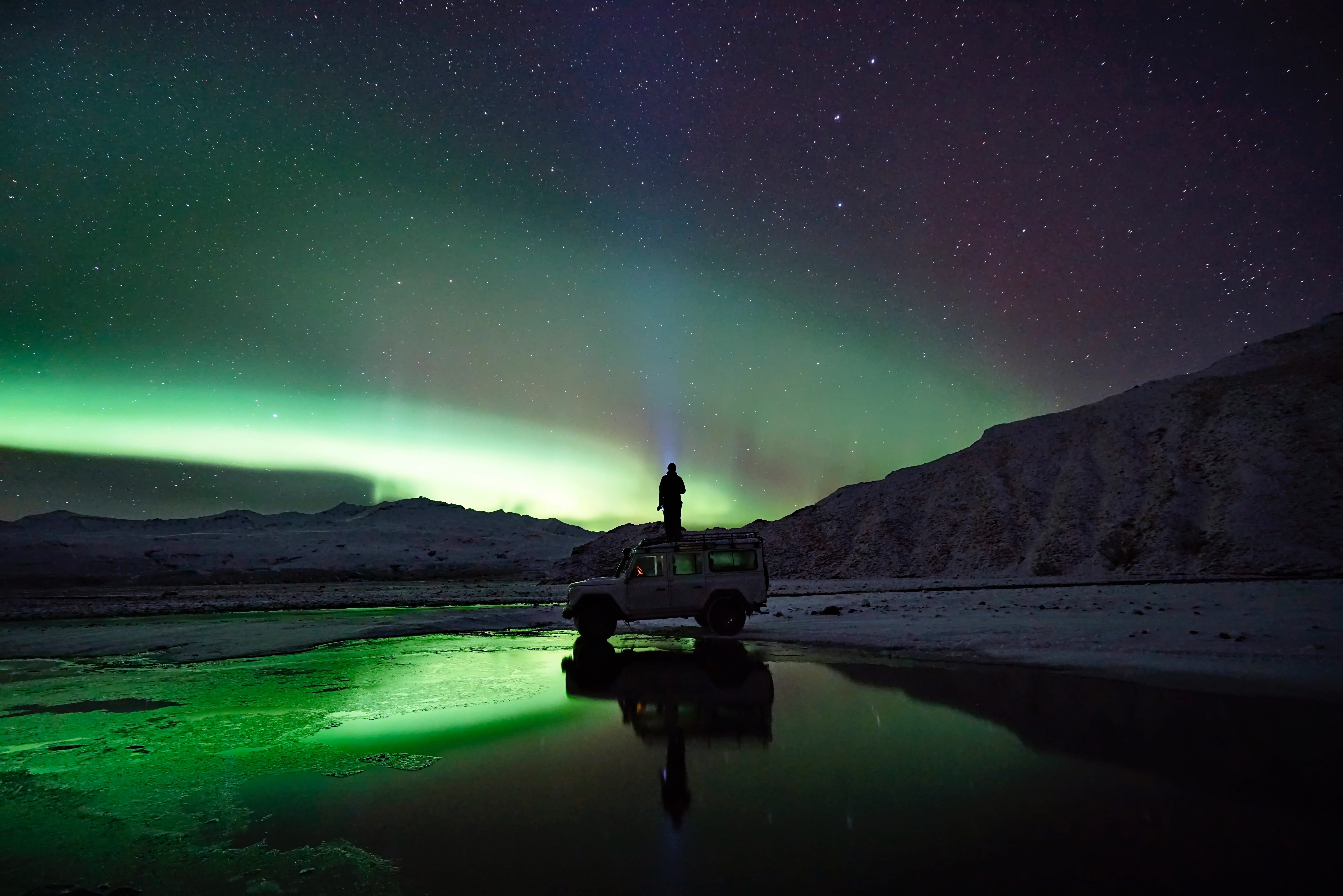 sky, space and astronomy, one person, suv, people, astronomy, outdoors, green color, front, water, standing, galaxy, nature, top, stars, man, mountain, HD Wallpaper