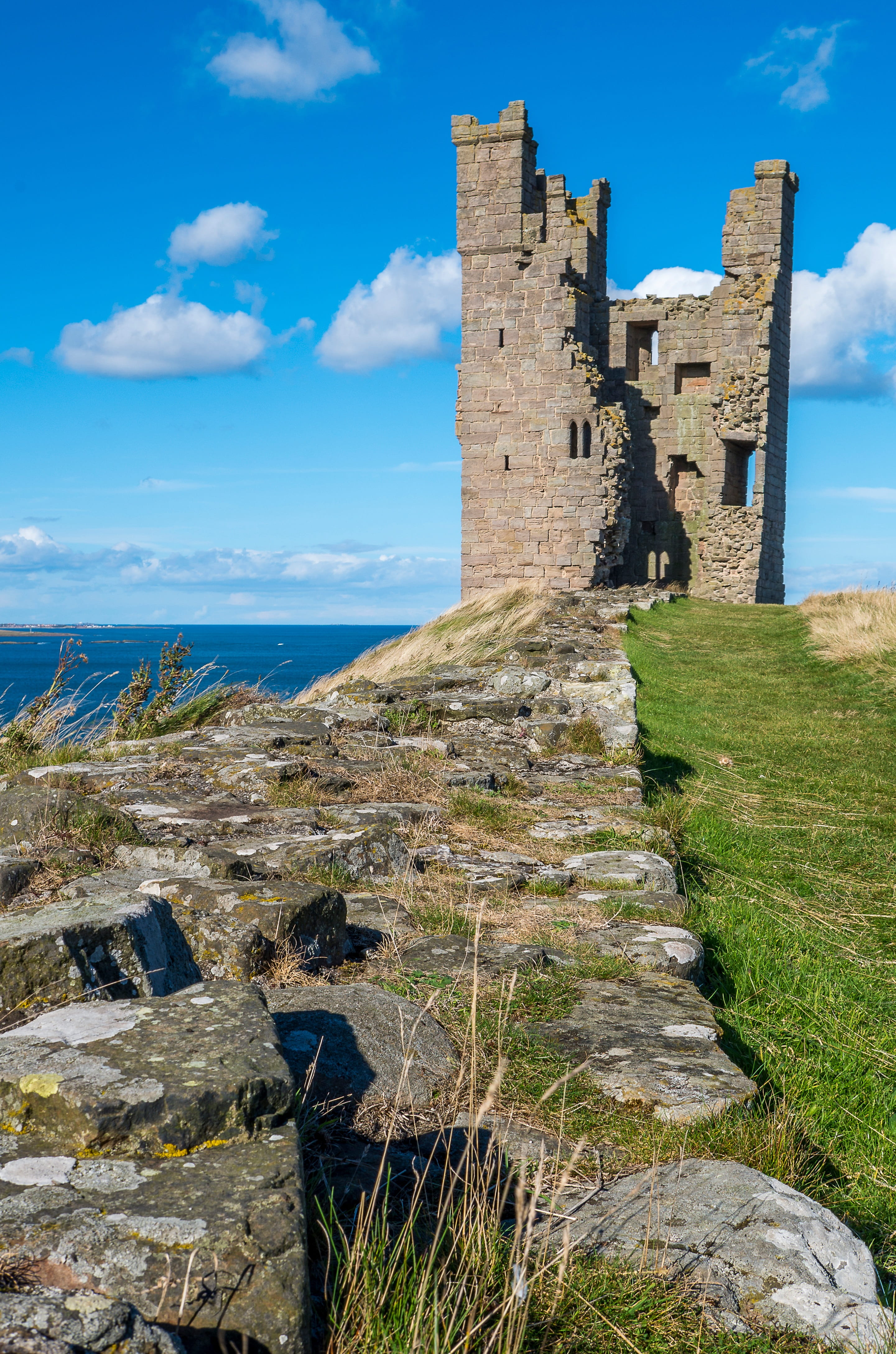 old, tourism, dunstanburgh castle, historically, 4K, ruin, old ruin, cloud - sky, ruined, north sea, sea, solid, history, day, united kingdom, travel destinations, Phone HD Wallpaper