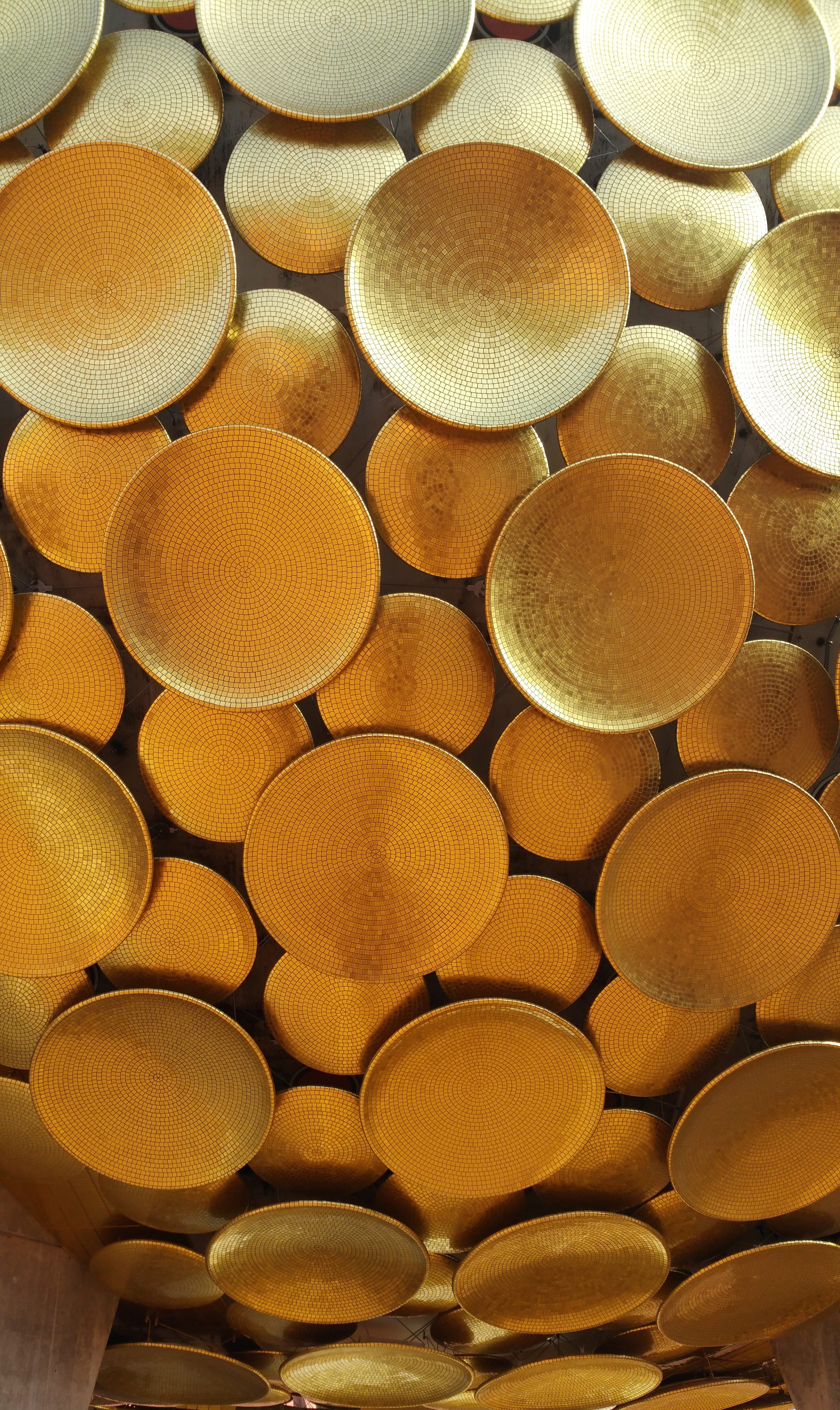 auroville, Gold, in a row, full frame, indoors, arrangement, yellow, shape, still life, pattern, wood - material, circle, large group of objects, geometric shape, Phone HD Wallpaper