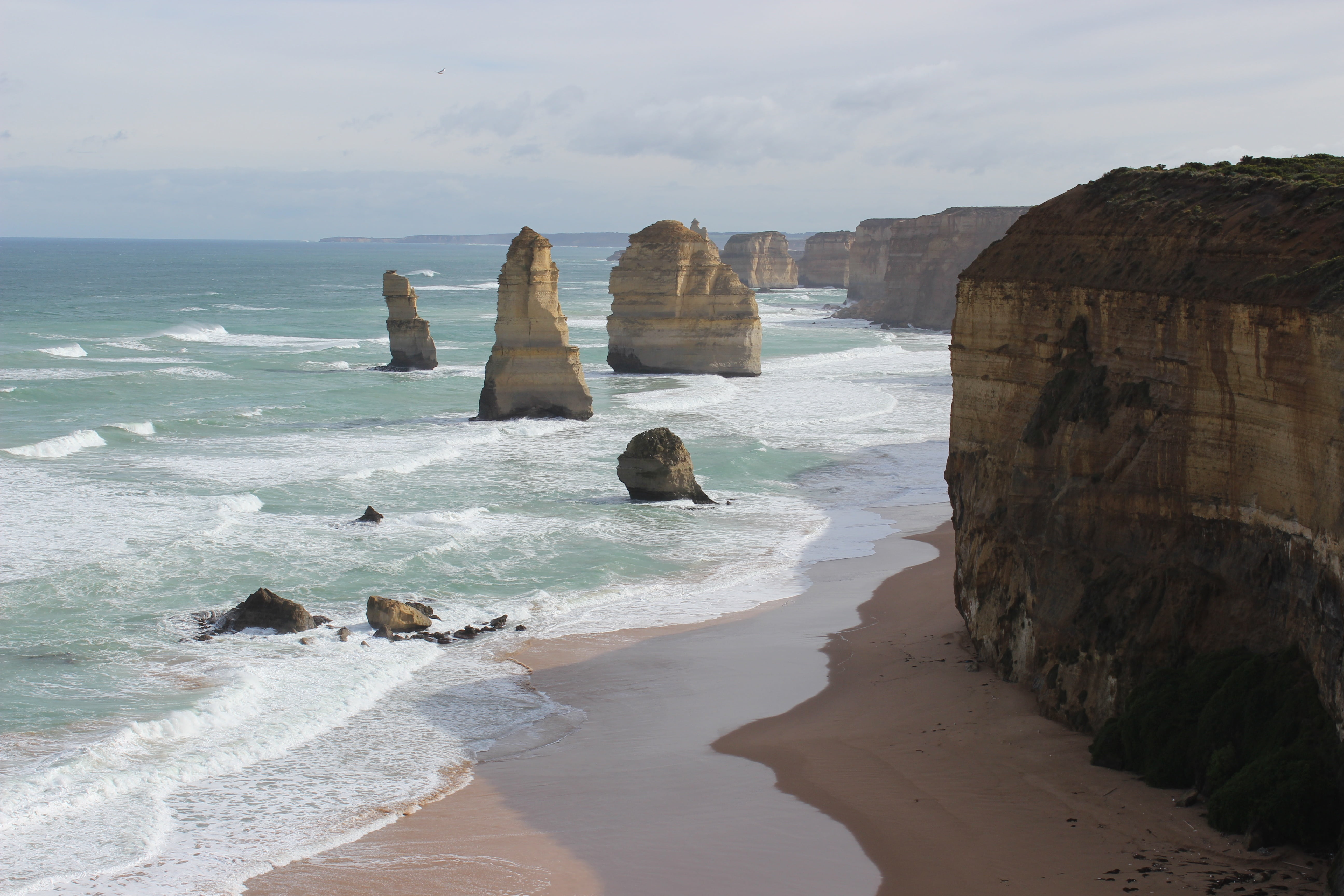 12 apostles, australia, beach, surfing, motion, outdoors, beauty in nature, rock, water, rock - object, horizon over water, aquatic sport, rock formation, HD Wallpaper