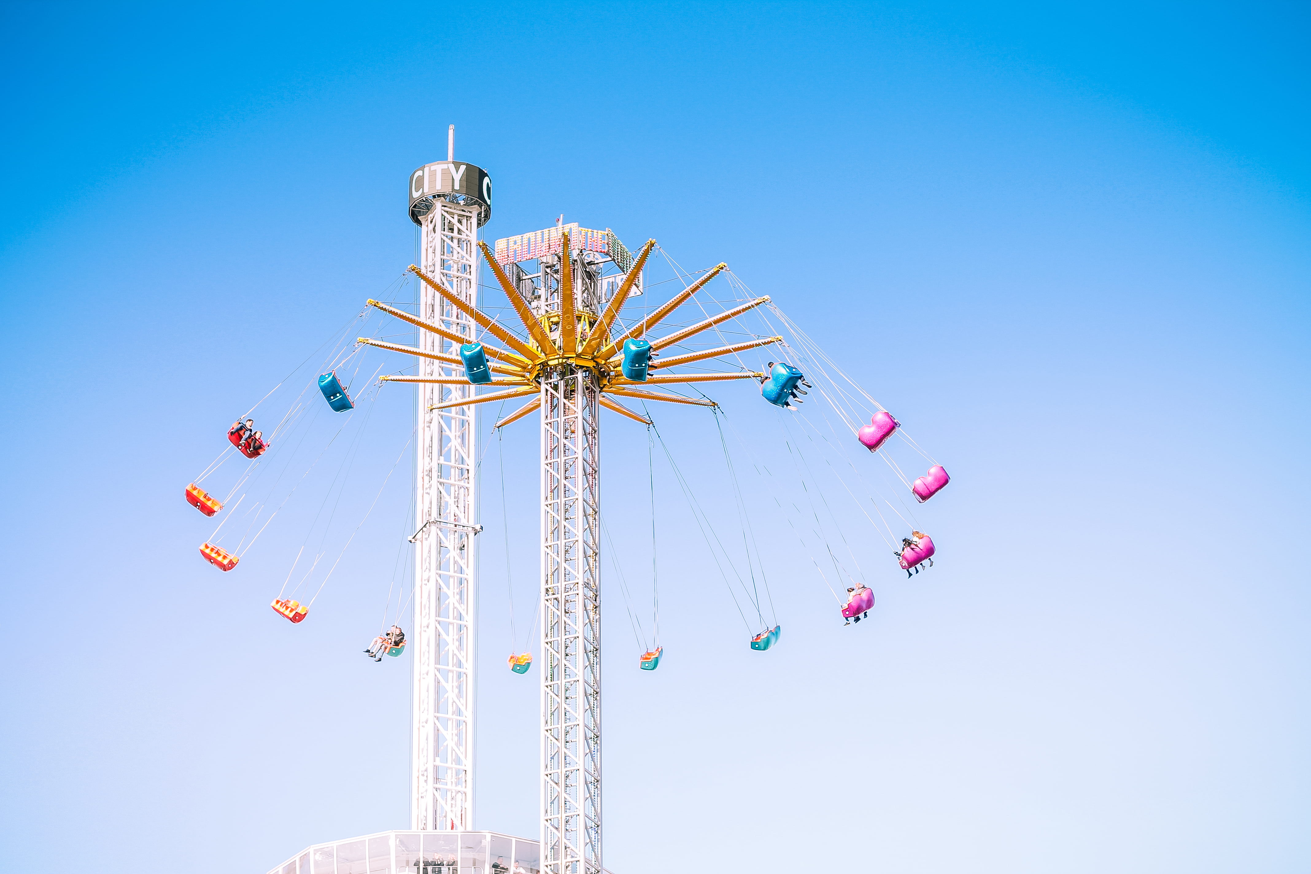 funfair, built structure, assorted, color, daytime, blue, enjoyment, arts culture and entertainment, ferris wheel, ride, fun, angle, sunny, amusement park, HD Wallpaper