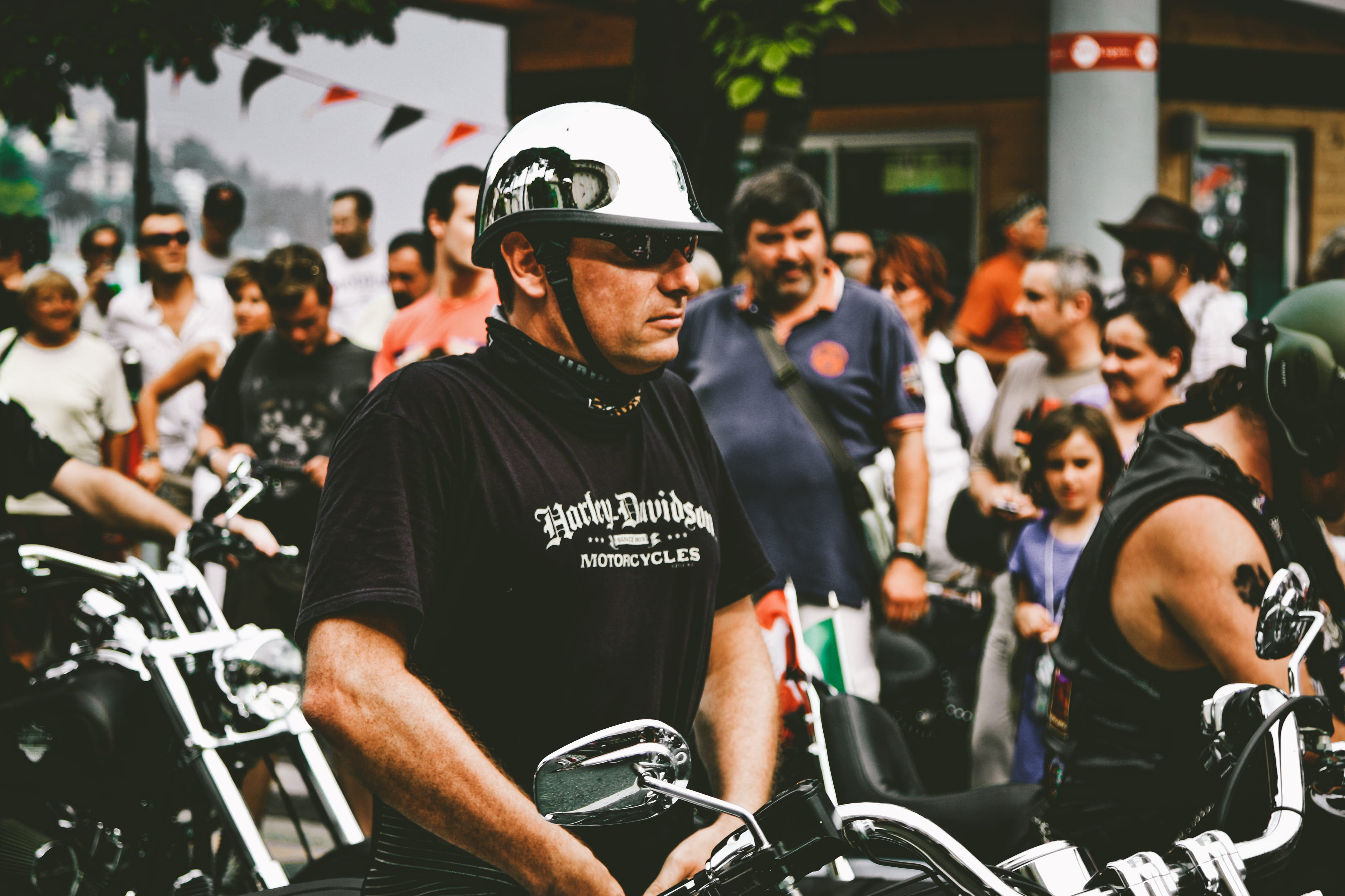 black shirt, rider, parade, clothing, black, focus on foreground, protection, blur, uniform, incidental people, depth of field, group of people, cap, festival, HD Wallpaper