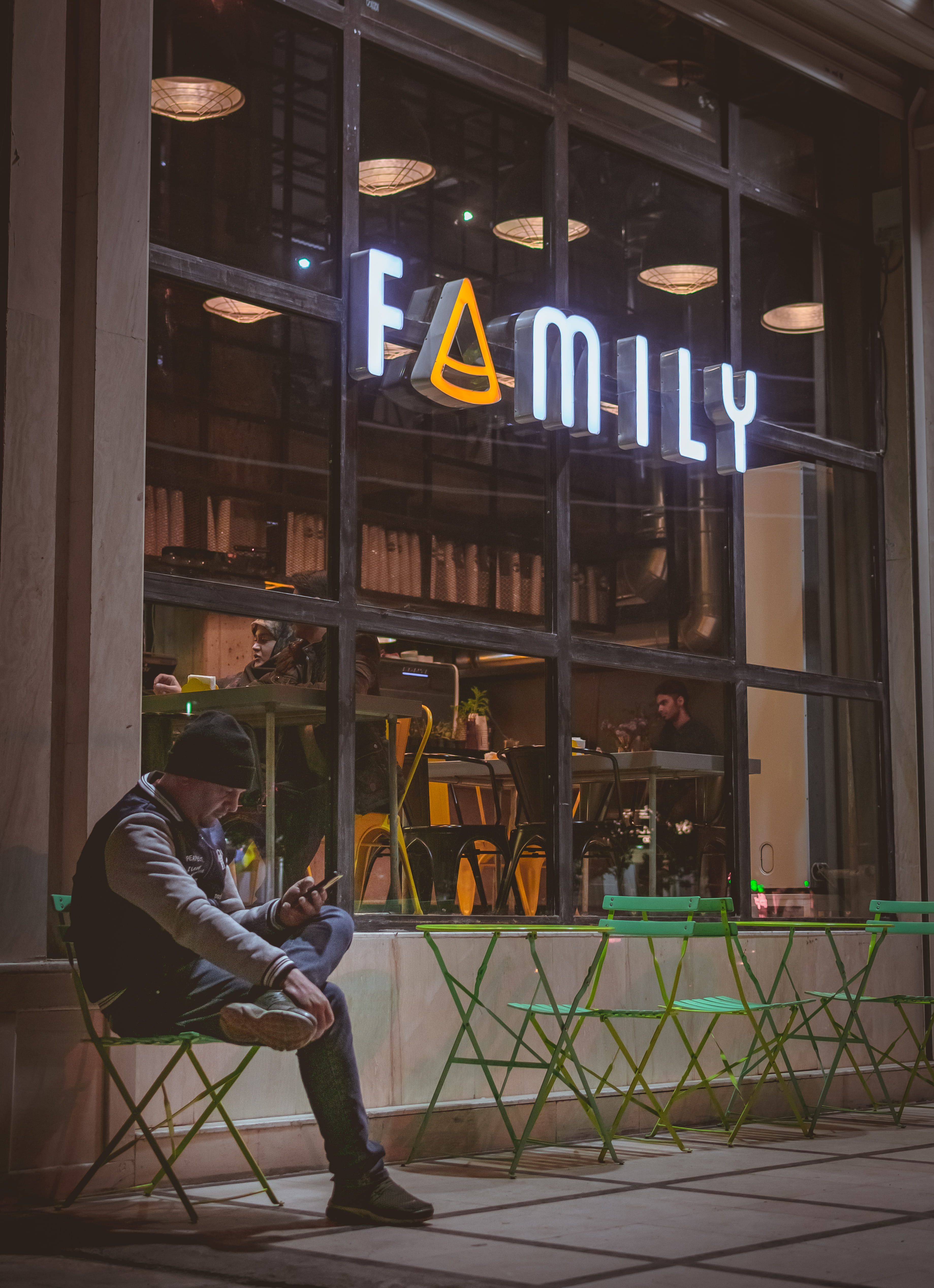 chair, building exterior, using, man, banister, shop, full length, sitting, outdoor, sign, food, window, 4K, family café ans restaurant, built structure, Phone HD Wallpaper