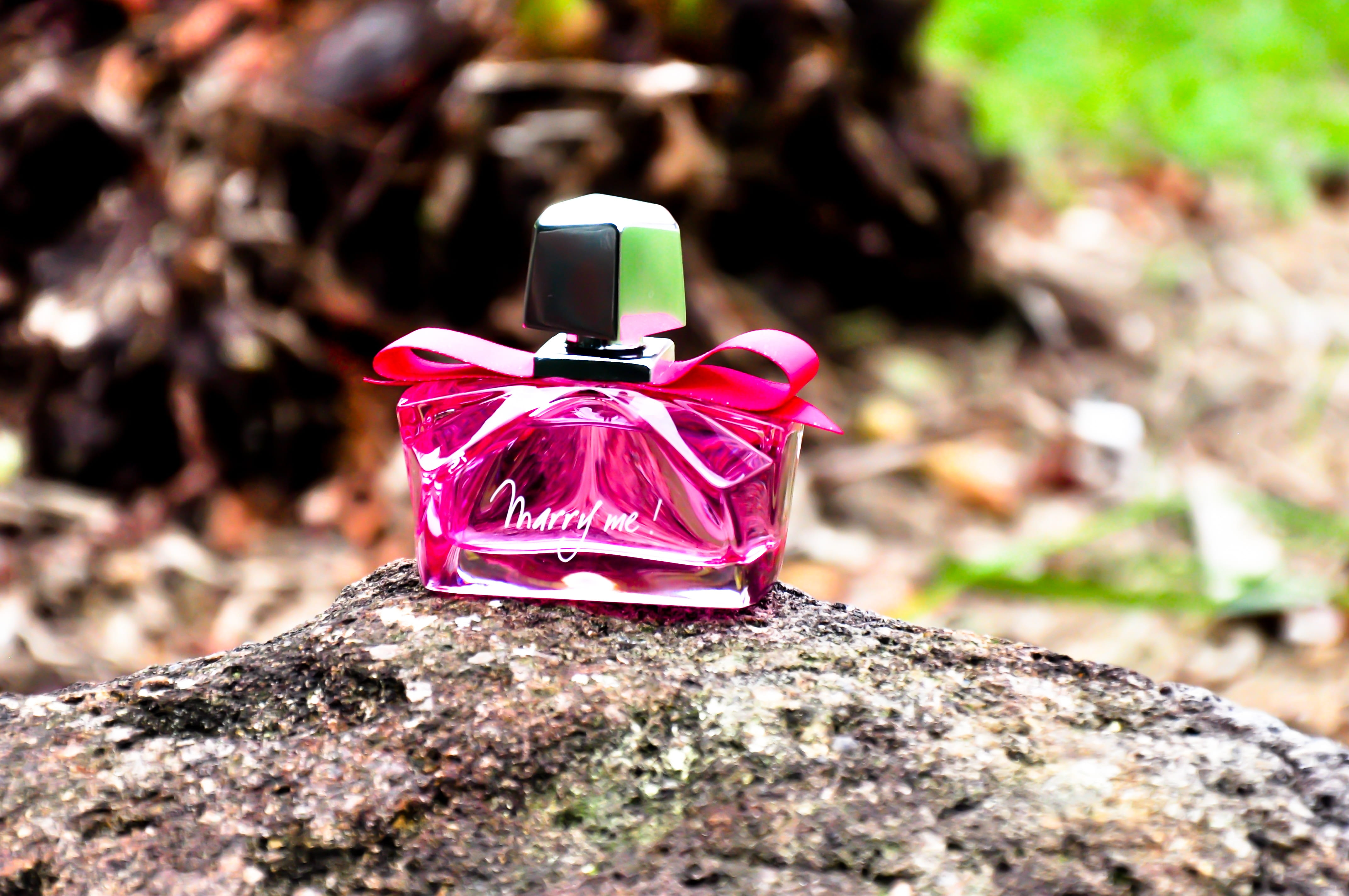 4K, perfume, pink, textured, toy, style, close-up, nature, pink color, love, sunlight, outdoors, selective focus, solid, rock - object, purple, day, plant, HD Wallpaper